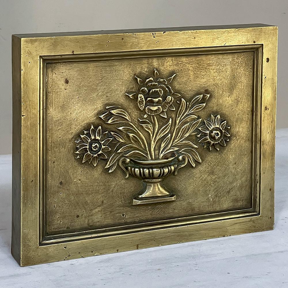 19th Century Cast Bronze Decorative Masonry Plaque was designed to be inset with a masonry wall, surround or framework to add a timeless decorative touch. Depicting a Greco-Romanesque urn bursting with flowers, it was cast from solid bronze, it is a