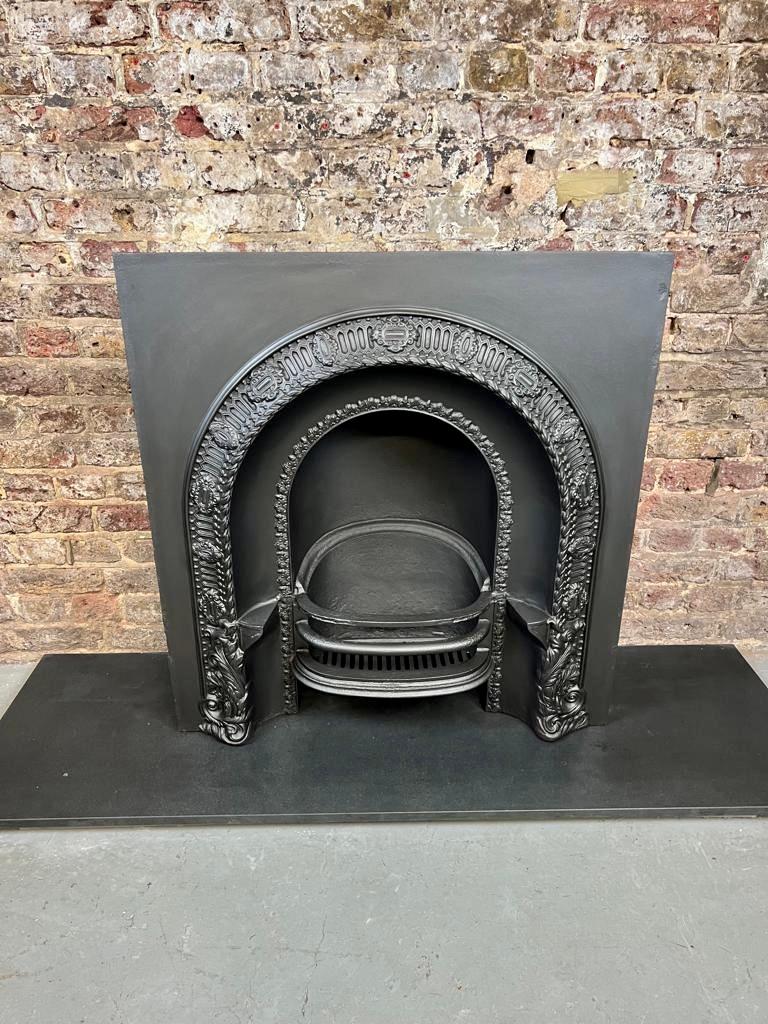19th Century Cast-iron Arch Fireplace Insert.
Original Victorian English Made Fireplace Insert. 
Decorative Arched Casting Pattern With Side Hobs. 
Recently Salvaged From a London Period Town House And Blackened To Original Finish
With Its Original