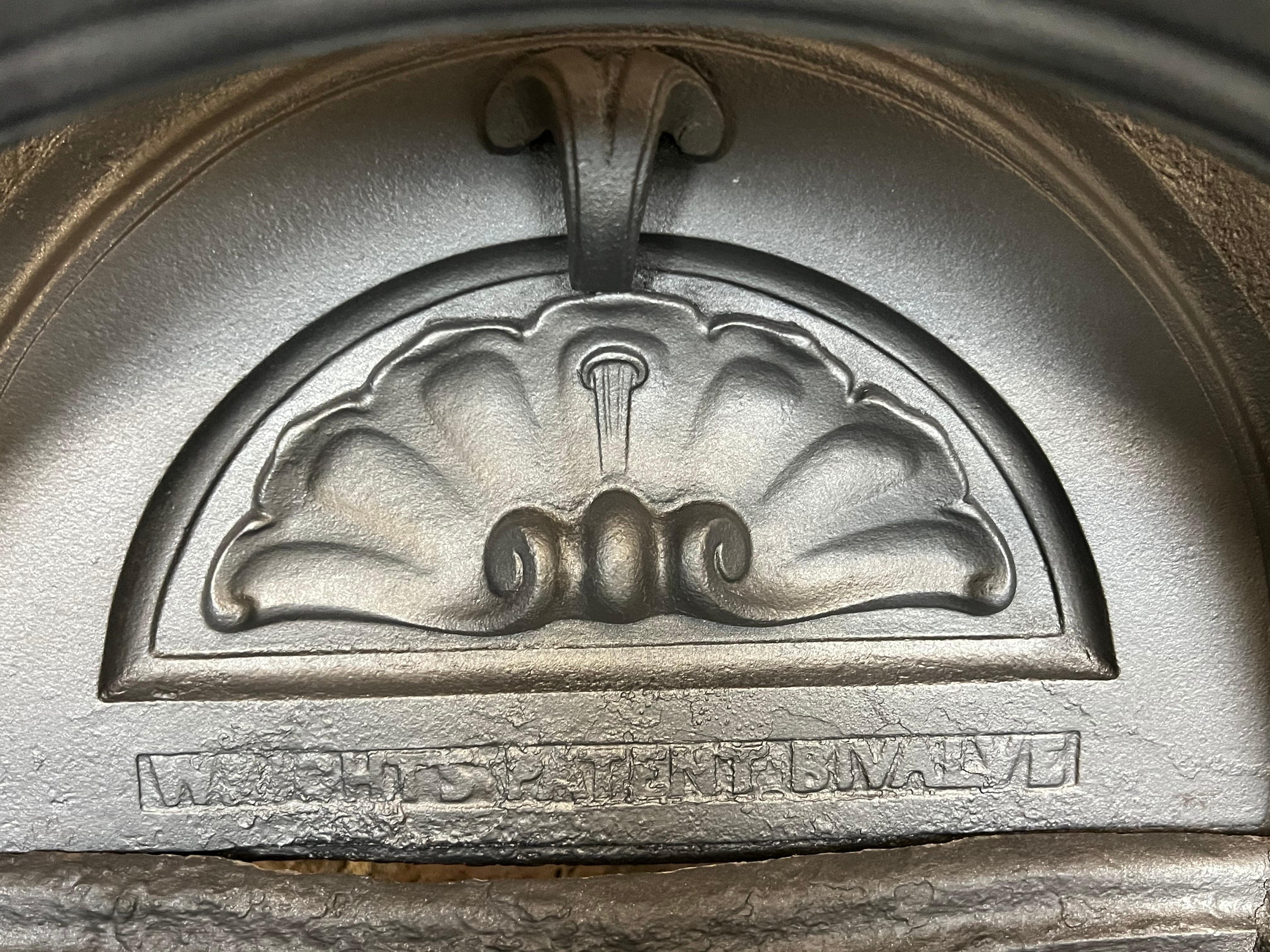 English 19th Century Cast-iron Arched Fireplace Insert