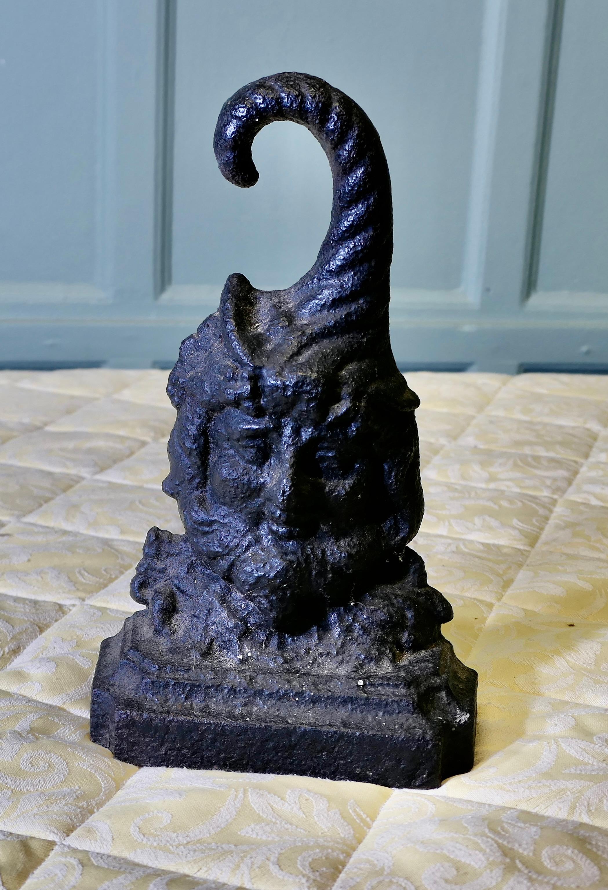 19th Century Cast Iron Bacchus Doorstop

Antique Bacchus Cast-Iron Doorstop he is  Bearded and has a Great Cornucopia Top this is a rare piece dating from the 19th Century
The doorstop is cast Iron and in sound used condition it is 11” high, 7” wide