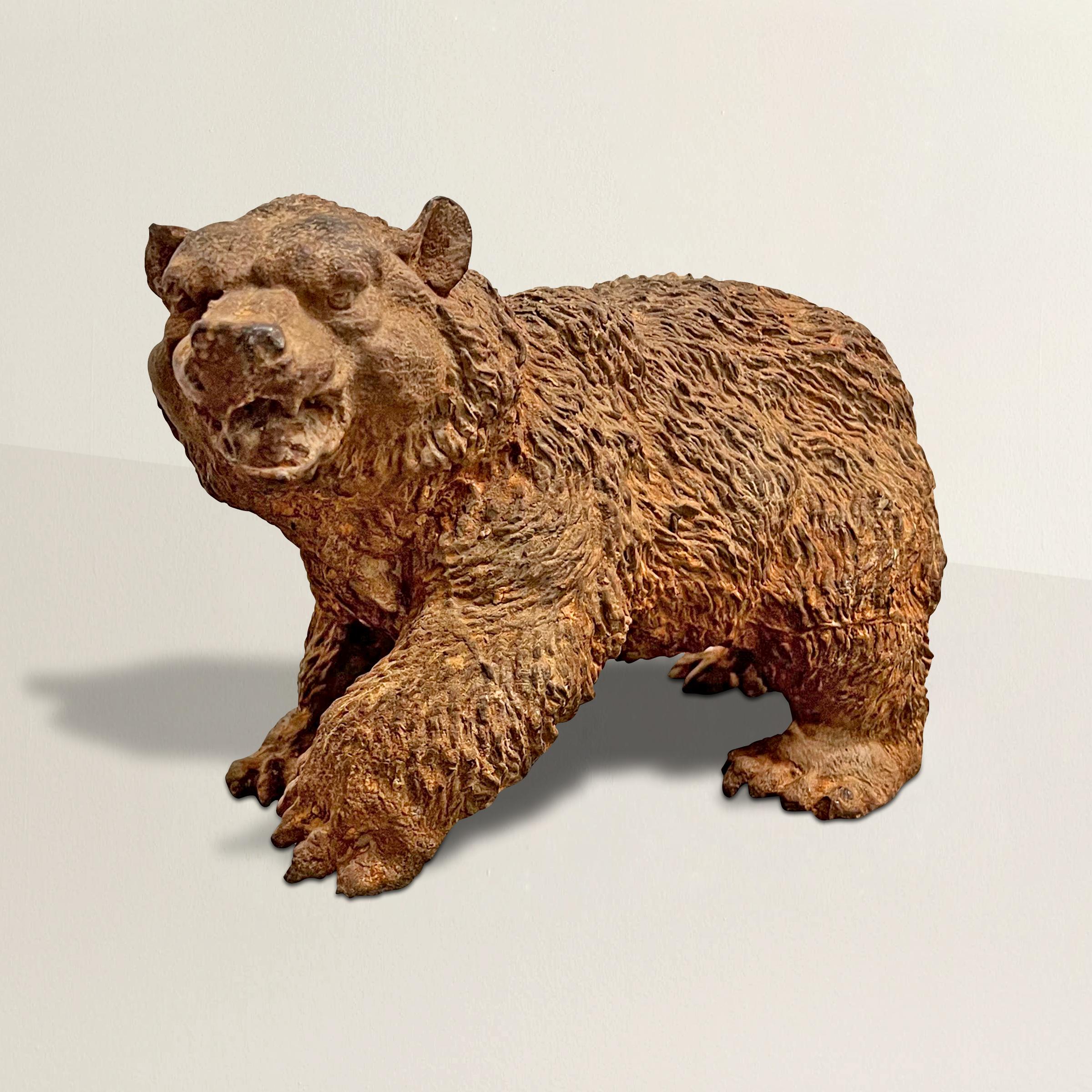 A bold 19th century American cast iron bear sculpture with wonderful attention to detail including expressive facial muscles, thick fur, and anatomically correct proportion. We believe this was part of a larger outdoor piece, possibly a fountain. It