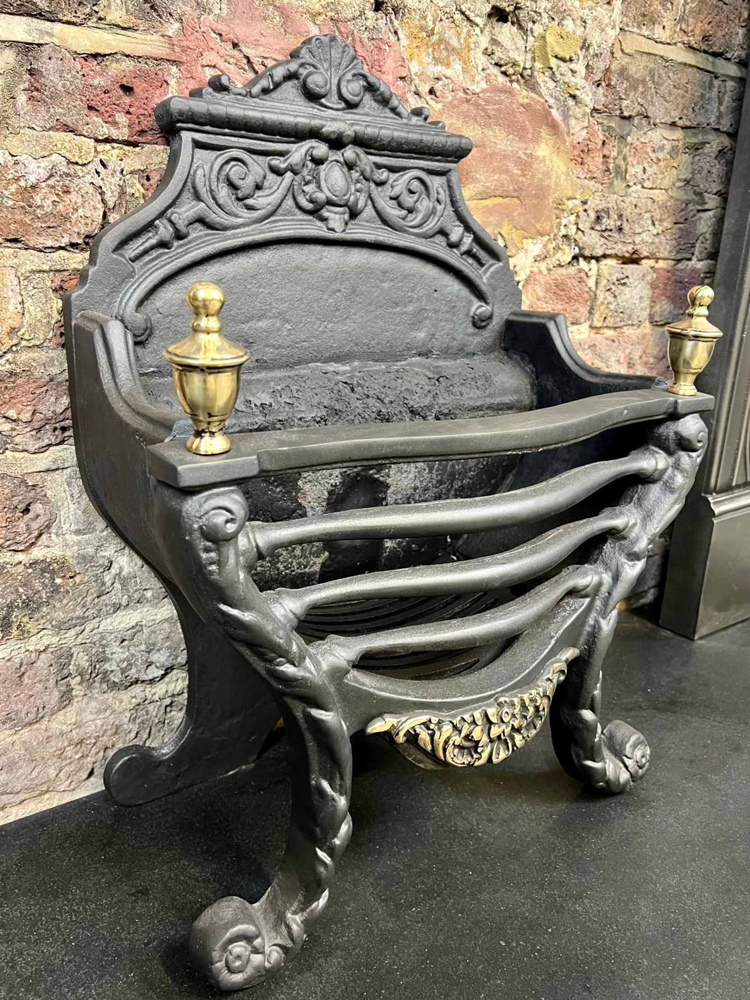 19th century cast iron & brass fireplace basket grate.
French Styled original victorian free standing fire basket & grate. 
This Typical French Styled Antique Basket Has A Traditional Blackened Finish With Brass Finials And Decorative Brass Foral