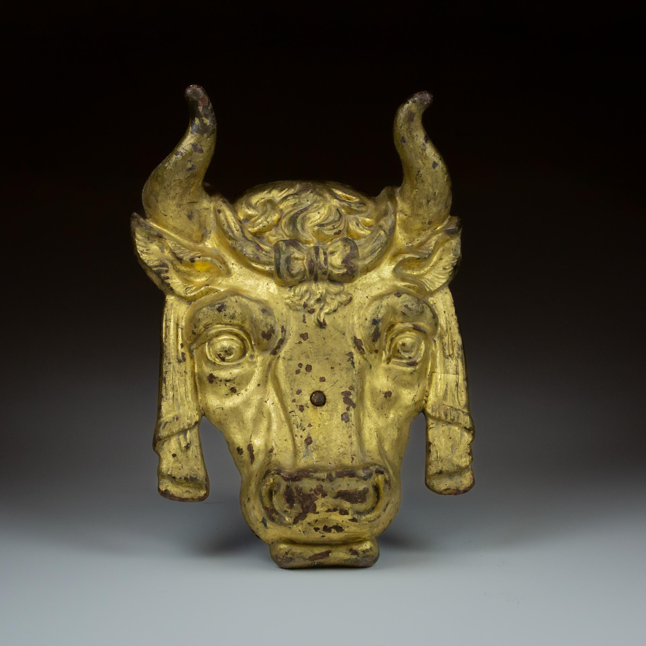 Remarkable Butchers or Cattle Breeders Trade sign. In the form of a prize Cow, adorned with swags and rosettes. Original Gilded finish. Cast Iron. France, Circa 1880.
