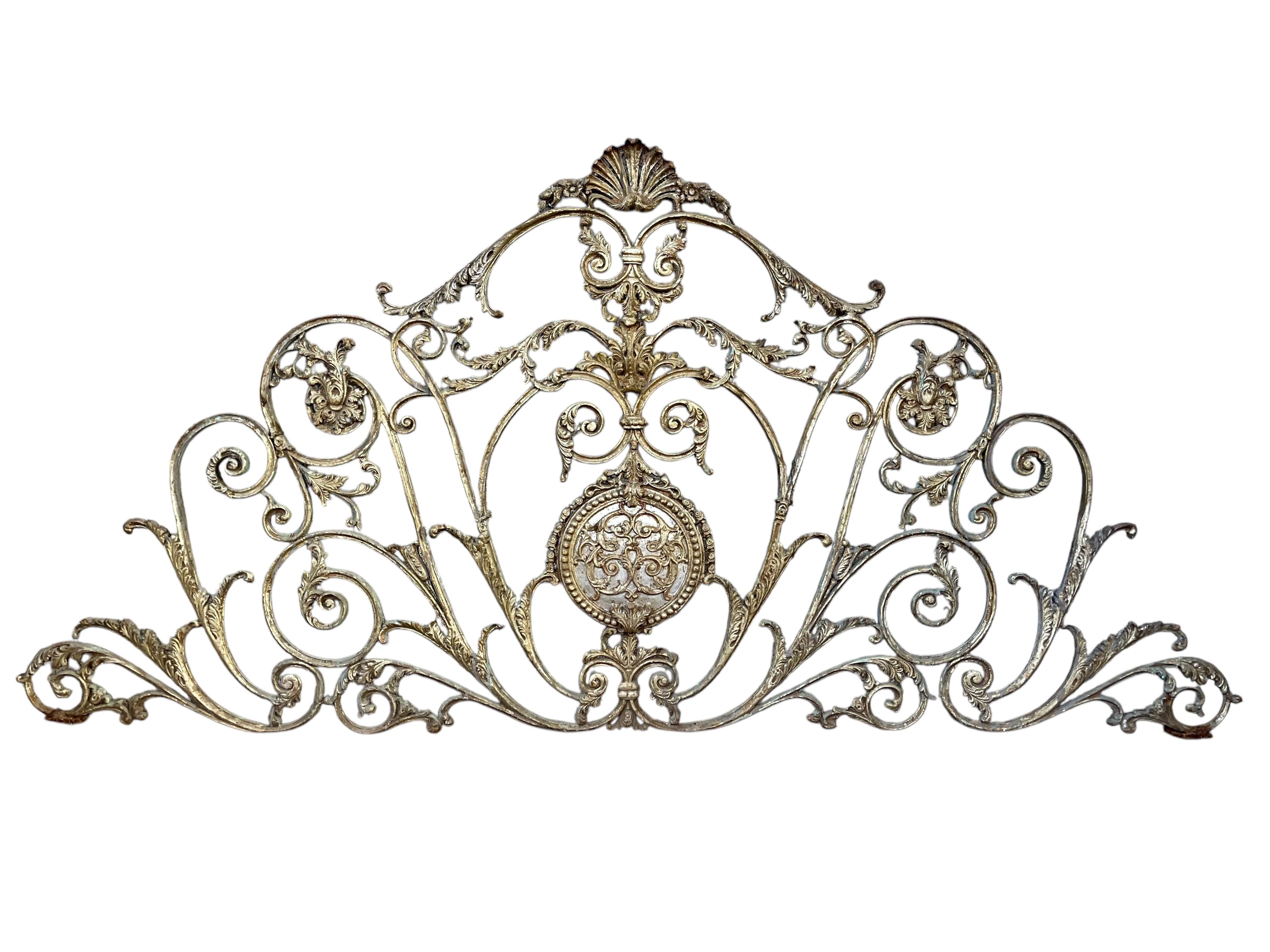 This is a beautiful and ornate piece of architectural salvage, likely a decorative iron or metalwork panel. 

This  intricately designed decorative metalwork panel, likely made of cast iron or wrought iron, exhibiting a high level of craftsmanship