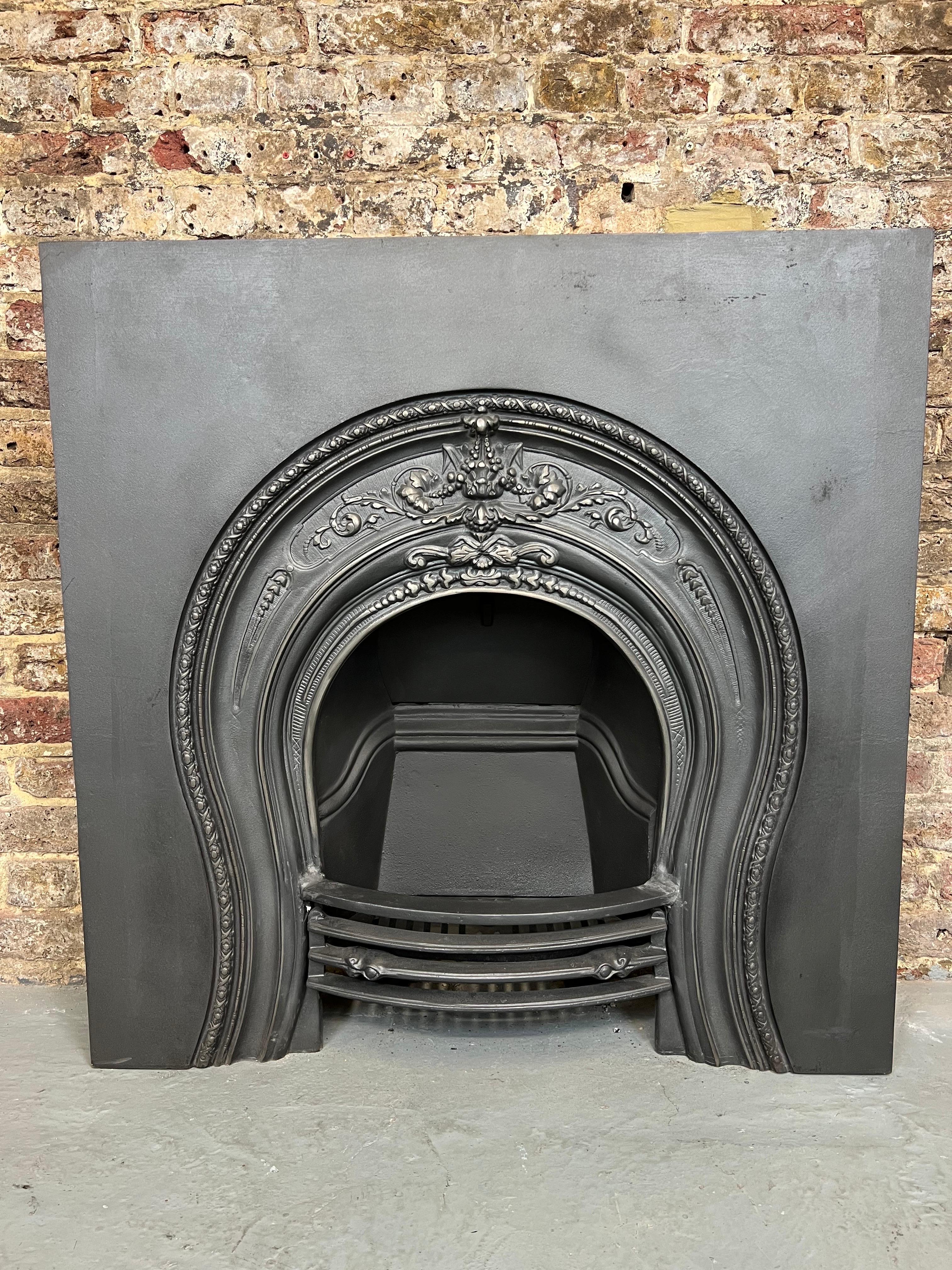 19th Century Cast Iron Fireplace Insert
English Made Circa 1880 From The Victorian Period.
This Classic Horse Shoe Shaped Arched Fireplace Insert Is Complete With Back & Front Bars.
In Traditional Blackened Finish. Recently Salvaged From A Period