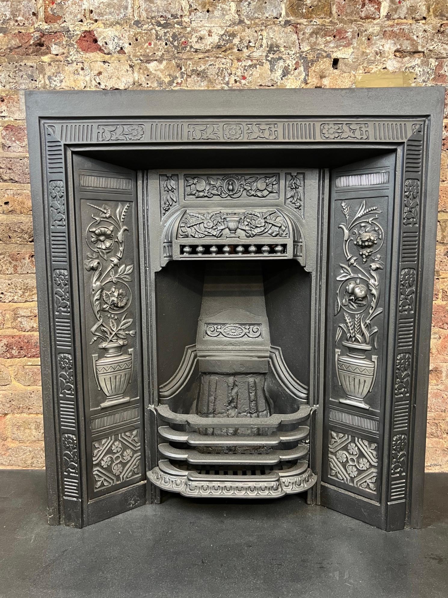 19th Century Cast Iron Fireplace Insert.
This Original Victorian English Made Fireplace Insert Has  
A Blackened Finish With Highlight Polish Decorative Floral Panels.
It Has Been Recently Salavaged From A London Town House.
Complete With Original