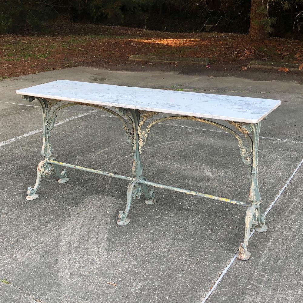 19th century cast iron honed marble top sofa French table, Confectioner's table is the perfect accompaniment to any room, with a shallow depth making it ideal behind the sofa, in a hallway, under a window, or anywhere you need a graceful, elegant