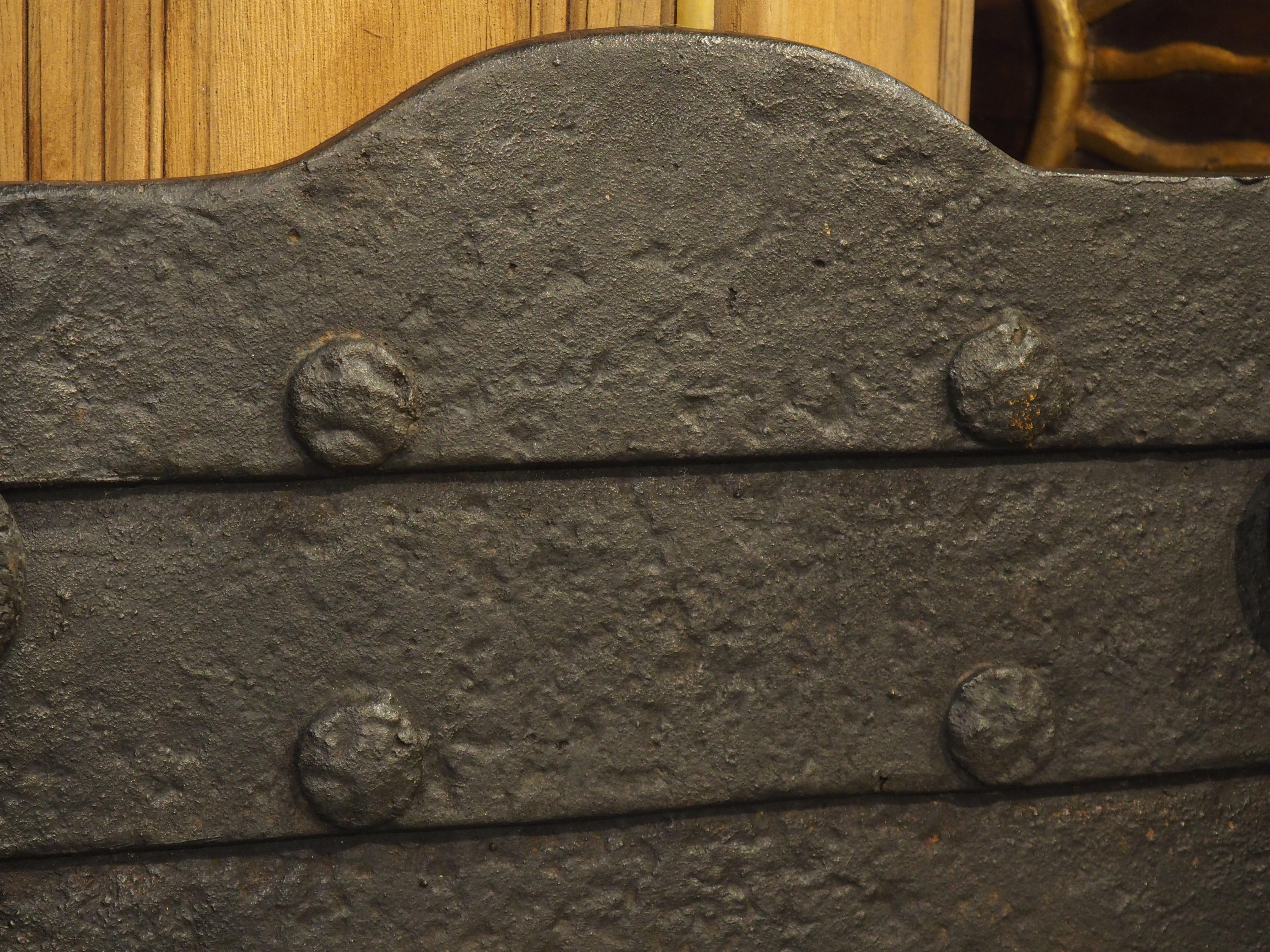 Metal 19th Century Cast Iron Medieval Style Fireback with Horizontal Lapping and Rings For Sale
