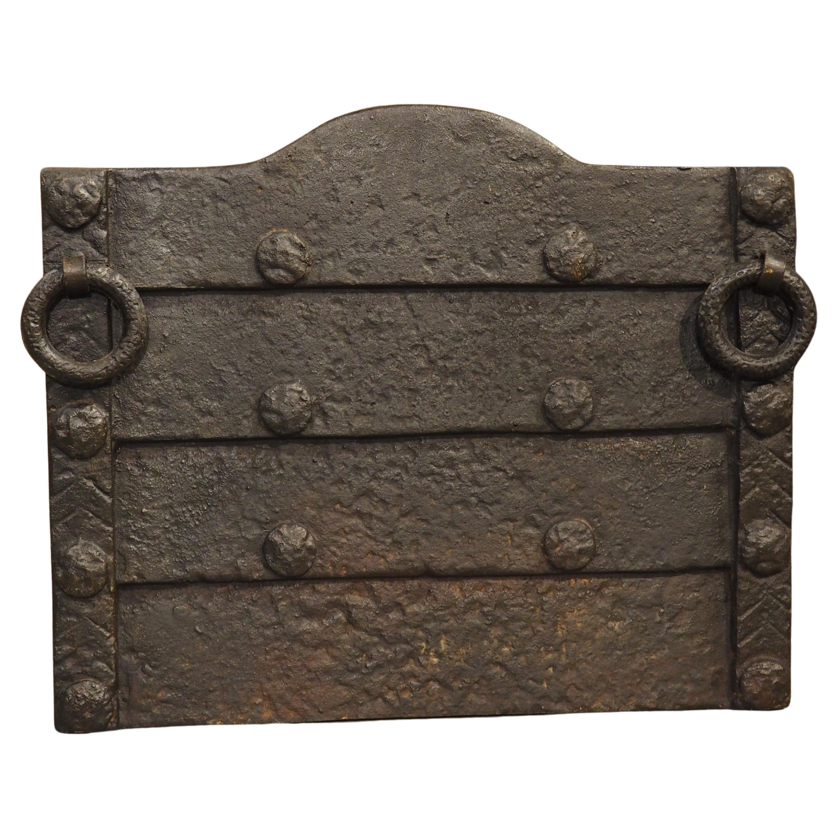 19th Century Cast Iron Medieval Style Fireback with Horizontal Lapping and Rings For Sale