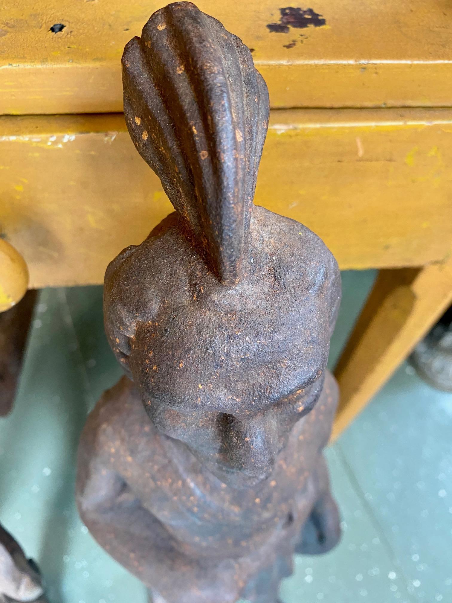 Rare 19th century cast iron Native American Andirons, circa 1880, thought to be an image of the Wampanoag Sachem Massasoit (1581 - 1661), early friend and protector of the nestling Plymouth Colony. The cast iron figure is that of a man wearing a