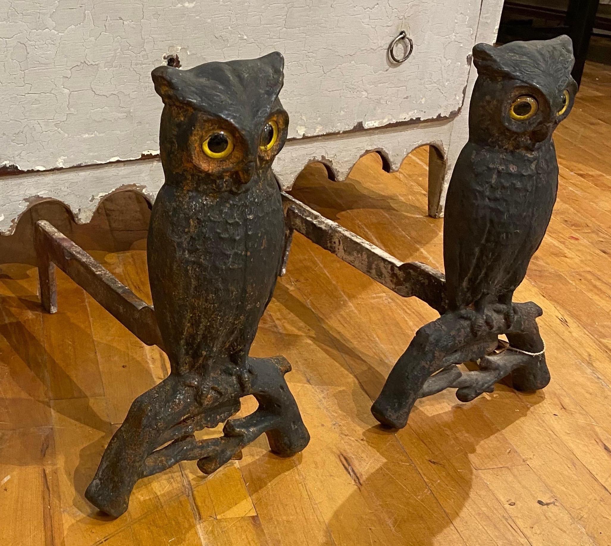 Pair of 19th century American made cast iron owl andirons with original glass eyes.