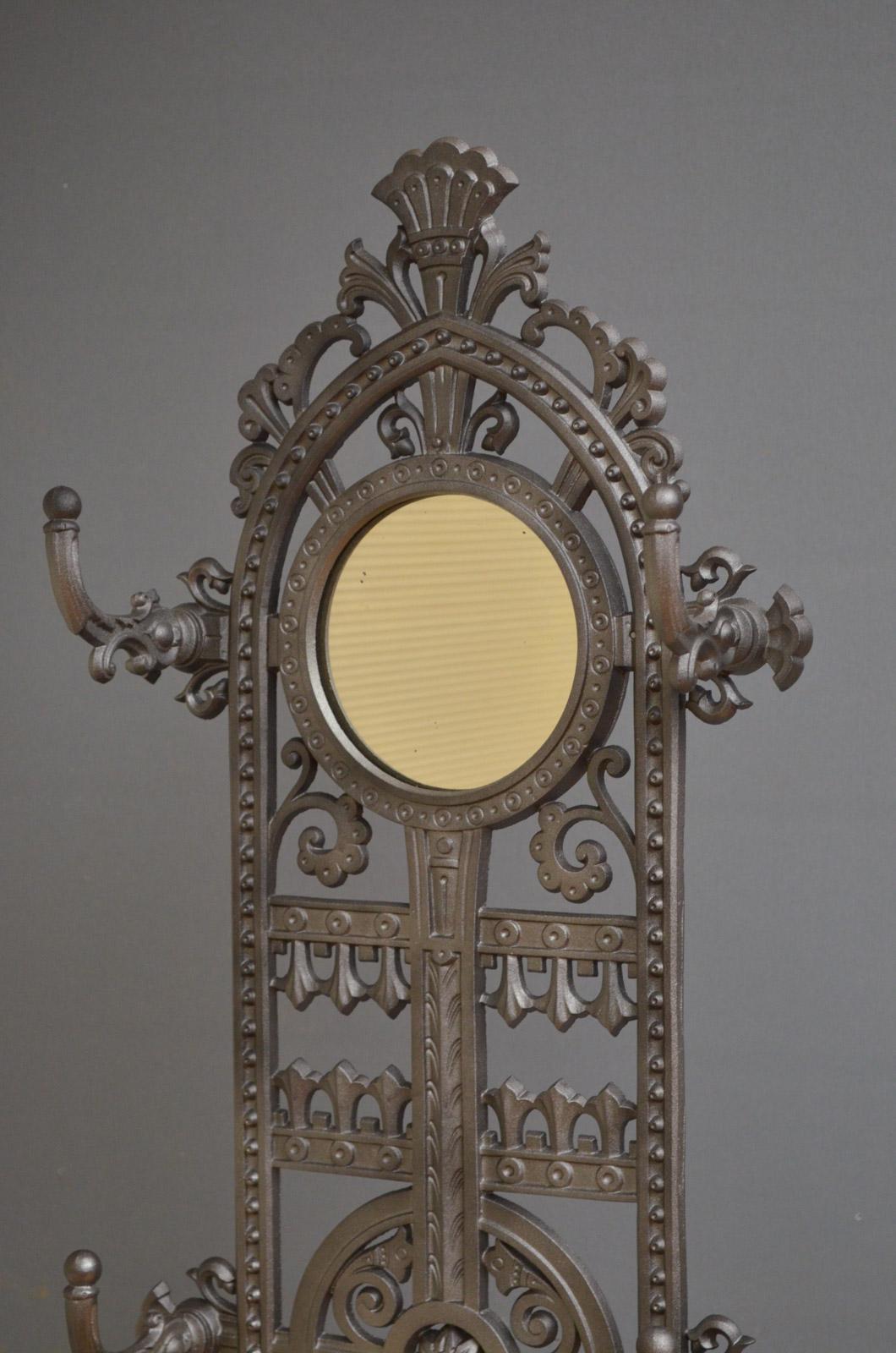Sn4386, truly excellent and very decorative, Victorian cast iron hall stand, having, original mirror to back and four-coat hooks over umbrella holder all with floral decoration throughout. This antique cast iron coat Stand is in excellent condition,