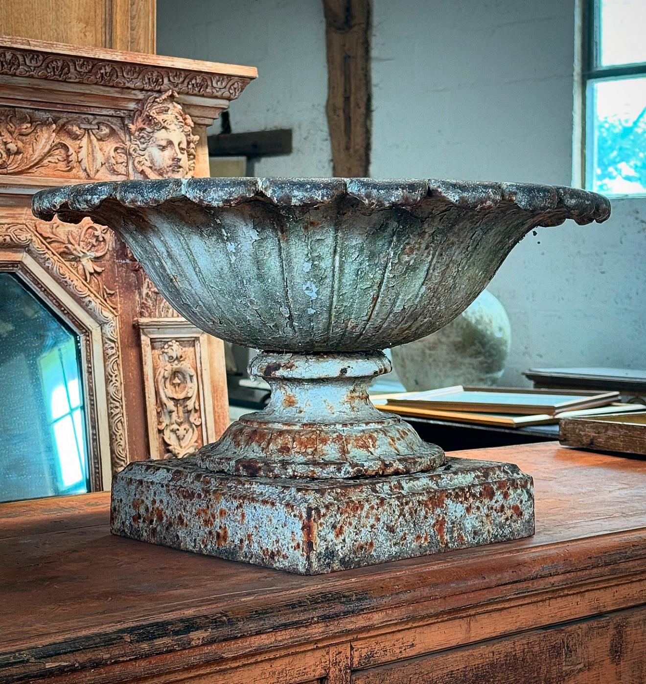 A beautiful 19th century cast iron Tazza urn with wonderful original weathered paint. This will look amazing indoors as a center piece or in the garden.

Please contact us directly for a worldwide shipping quote.