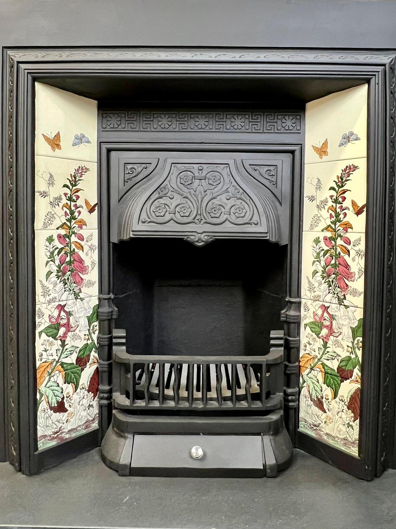 19th Century Cast Iron Tiled Fireplace Insert.
Great Example Of A Fine English Victorian Antque Fireplace.
English Made Circa 1880 With Classical Victorian Floral & Petal Detailing. 
Complete With Fireback, Canopy Hood And Firegrate. 
Included Is