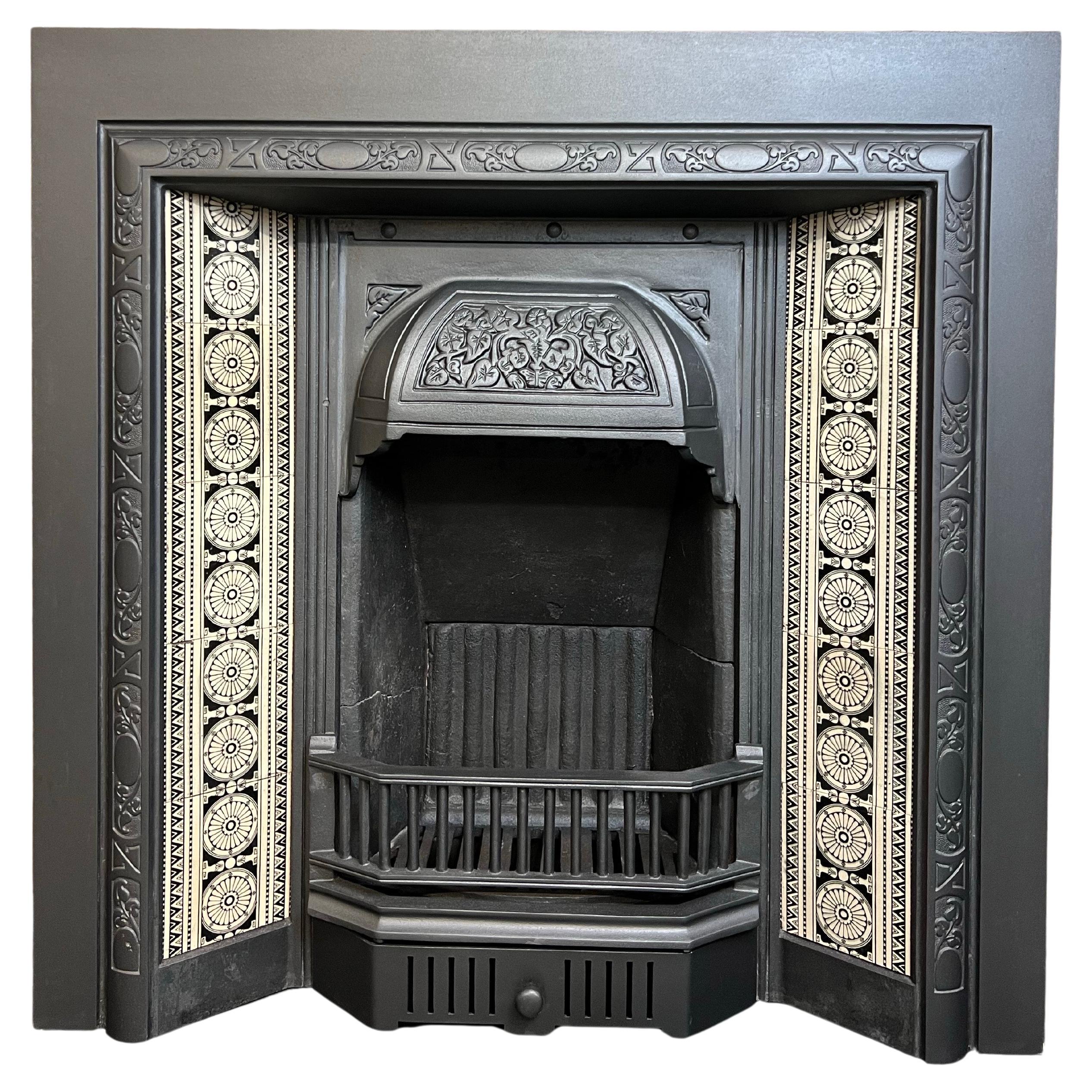 19th Century Cast Iron Tiled Fireplace Insert.
A Fine Original English Made Victorian Fireplace Insert.
Blackened Finish Including Original Set Of Ceramic Fireplace Tiles, 
Decorative Canopy Hood, Front Bars And Fire Back.
Recently Salvahed Fromr An