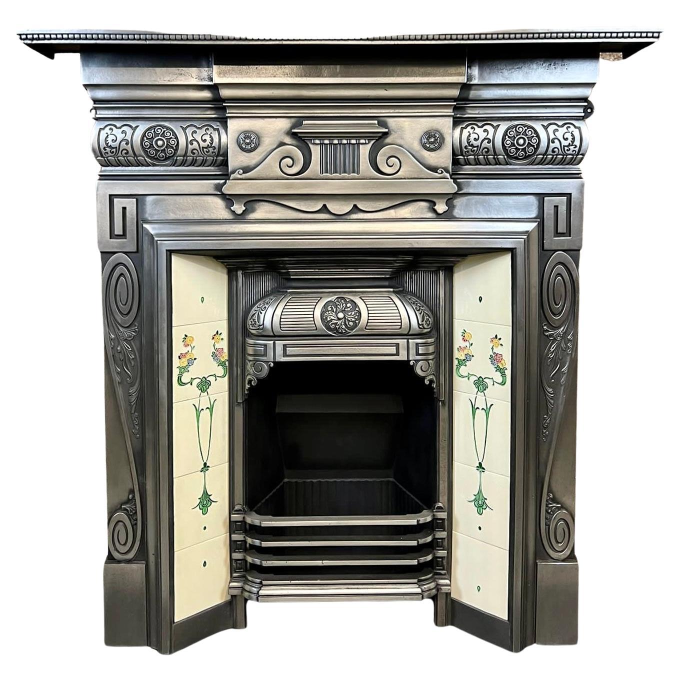 19th century cast iron tiled fireplace mantelpiece.
This fine example of an Antique original Victorian fireplace has a fully Burnished (Polished) Finish.
It is complete with fire 9.5 inch depth back, set of front bars, and decorative fixed hood.