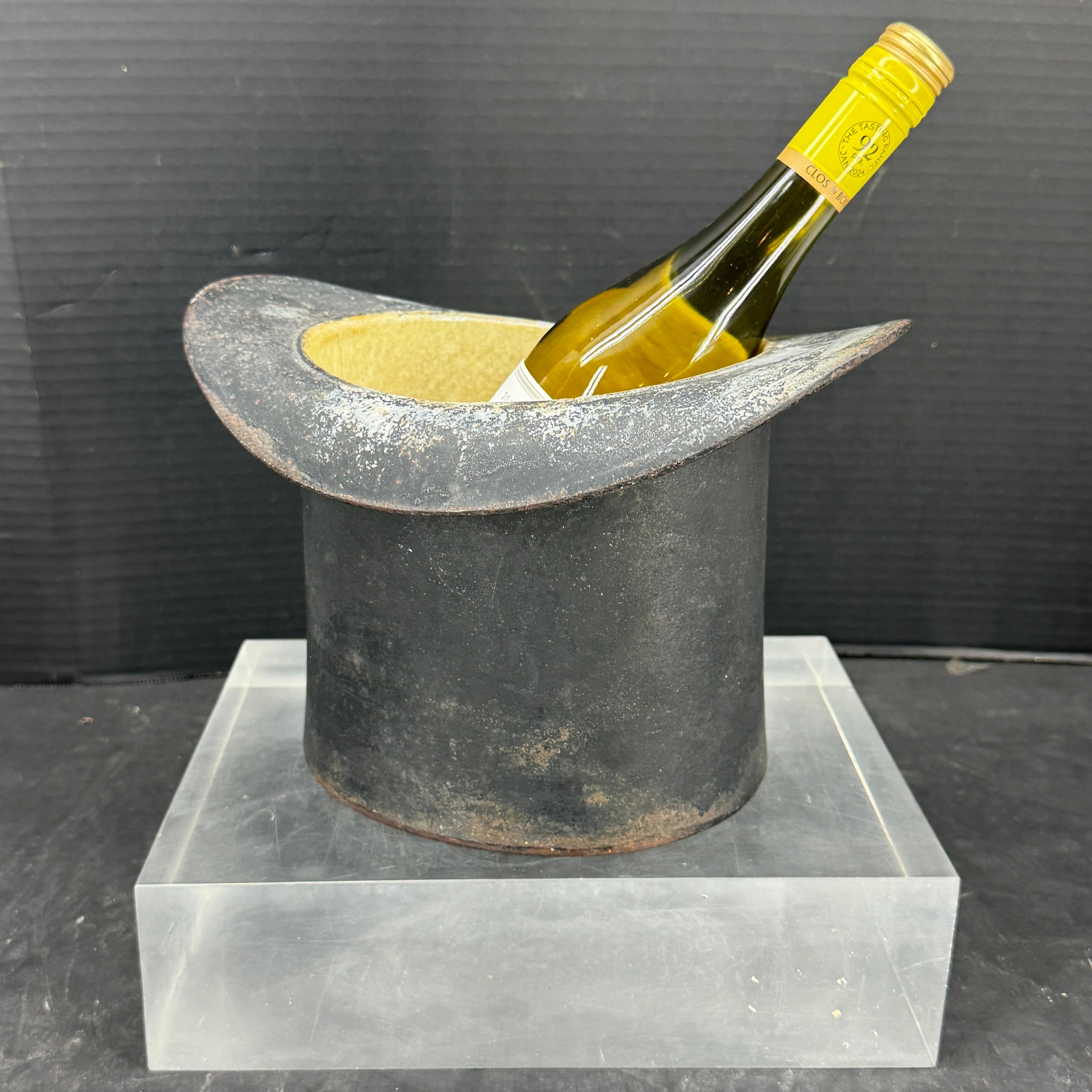 Charming is the best way to describe this heavy late 19th Century spittoon black top hat container. We love the idea how this cast iron piece can be repurposed functioning even as a wine chiller or vase! Would make such a statement at a party. The