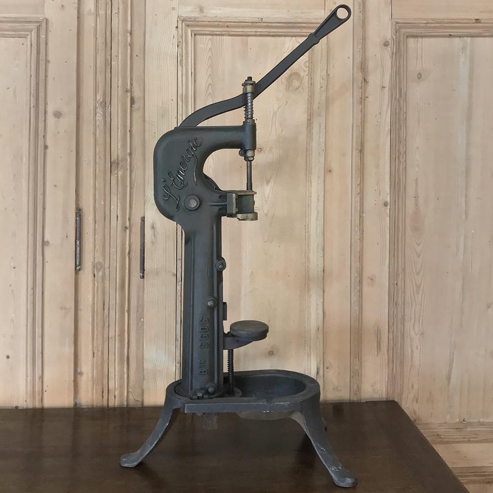 19th century cast iron wine bottle Corker or Corcier is an ingenious product of the Industrial Revolution with a complex dual spring return system and a design that ensures the least amount of spillage. The model was designated the appellation