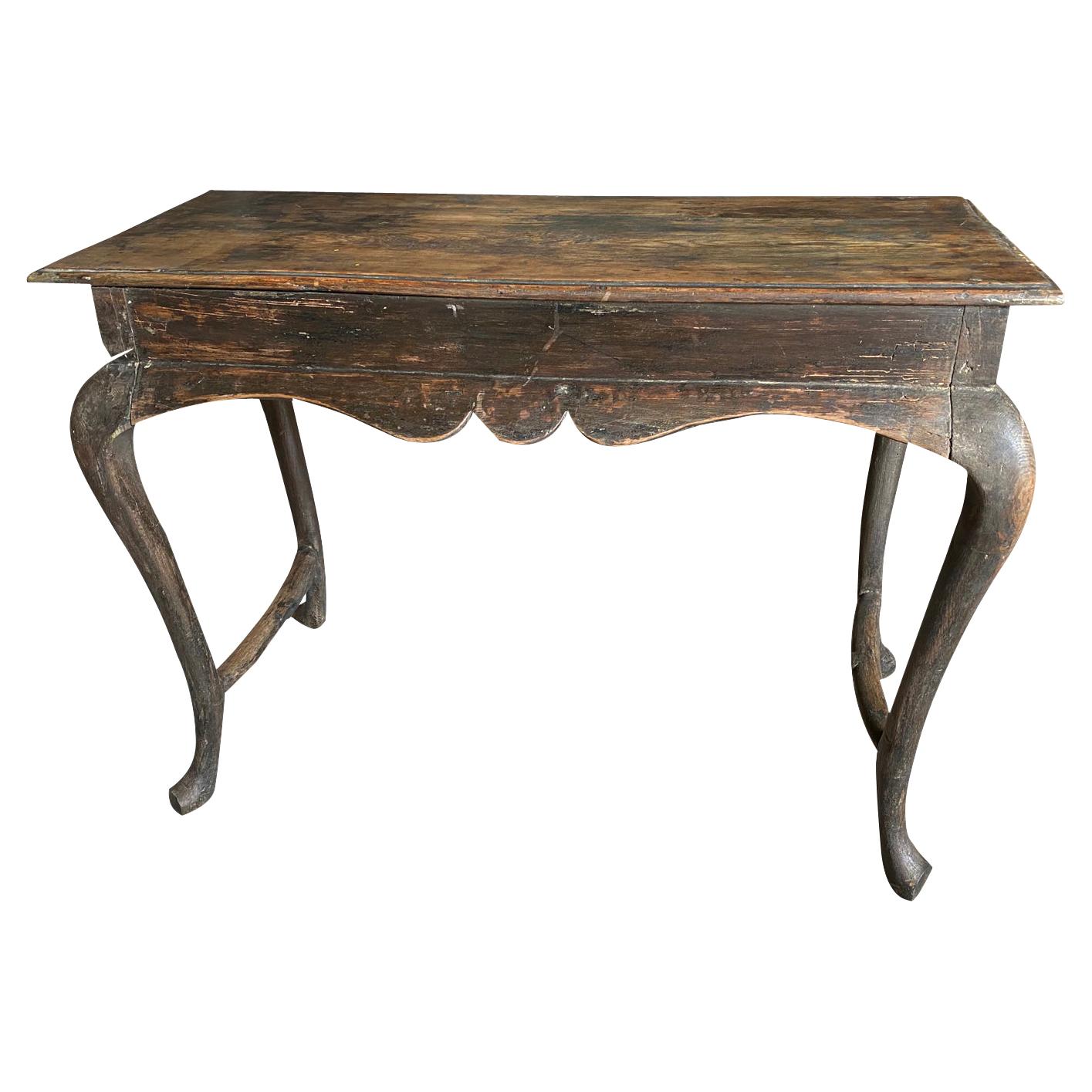 A very lovely 19th century console table from the Catalan region of Spain. Beautifully constructed from painted wood with a sculpted apron and gentle cabriole legs.