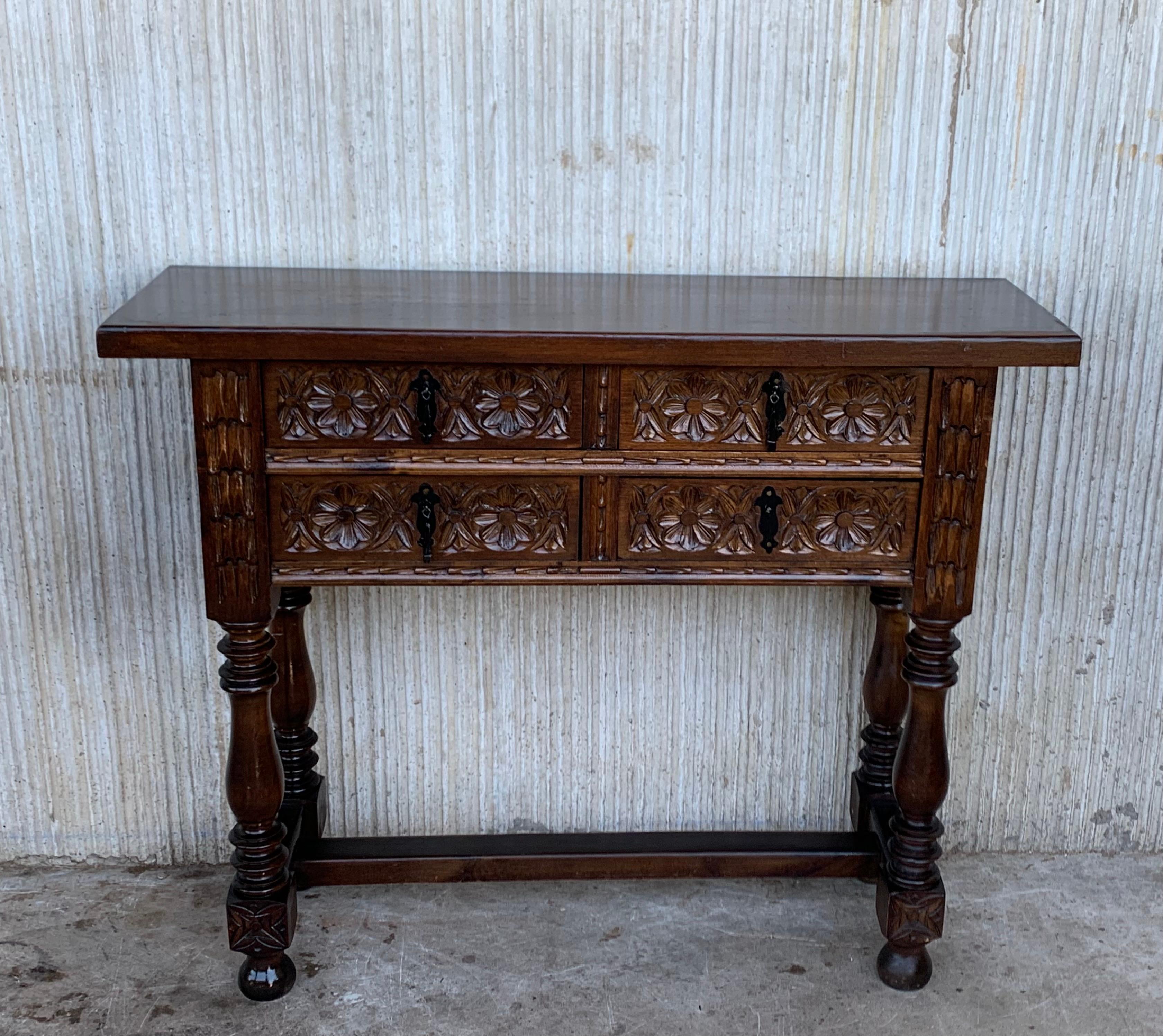 19th century Spanish antique walnut console sofa table with the four drawers and original iron hardware.
You can use like a commode or chest of drawers
This elegant console was crafted in Spain, circa 1890. The sofa table with four legs features a