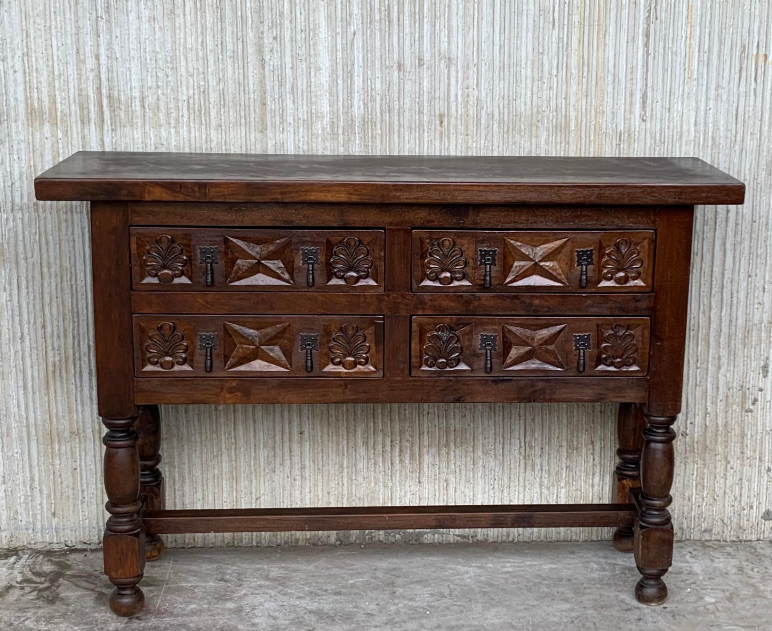 19th century Spanish antique pine walnut console sofa table with the four drawers and original iron hardware.
You can use like a commode or chest of drawers
This elegant console was crafted in Spain, circa 1890. The sofa table with four legs