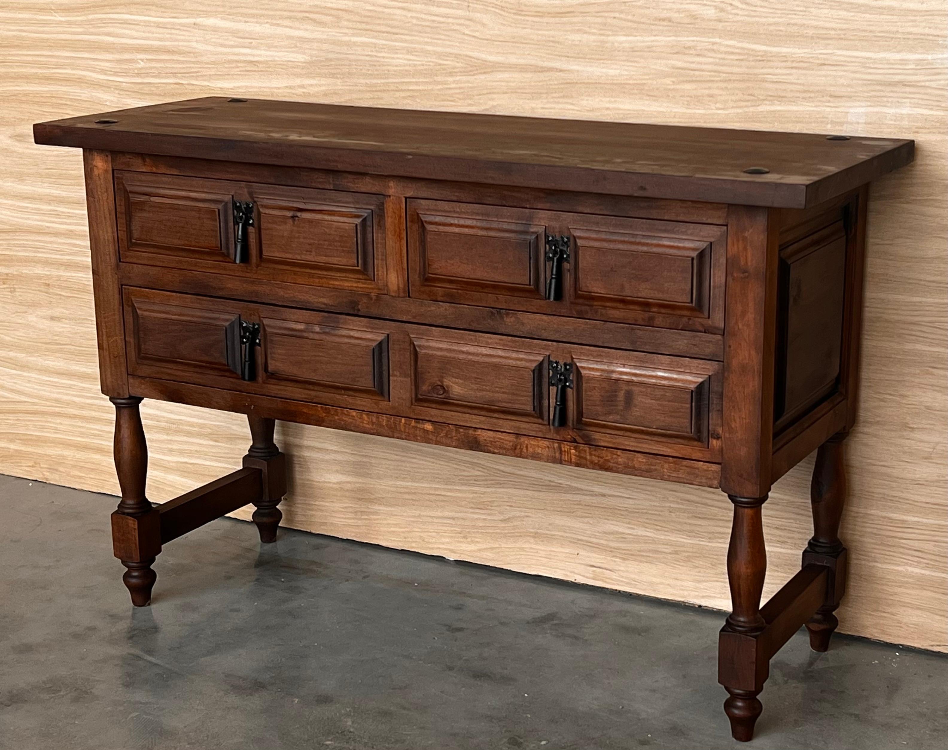 19th century Spanish antique walnut chest of four drawers and original iron hardware.
You can use like a commode or chest of drawers or large nightstand.
This elegant console was crafted in Spain, circa 1890. The sofa table with four legs features a