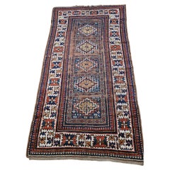 Tappeto caucasico Kazak del XIX secolo con motivo geometrico in blu, avorio e rosso