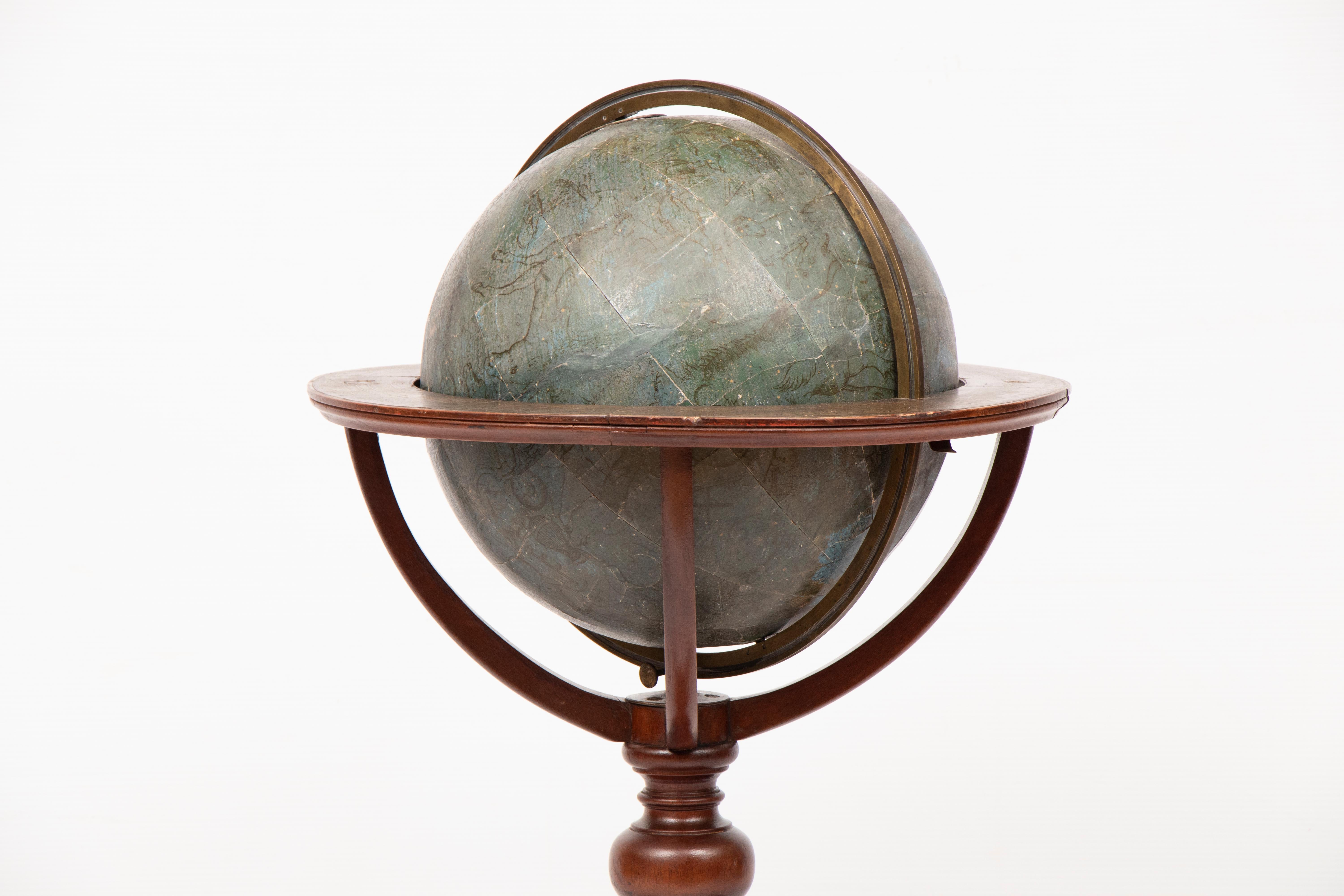 19th century celestial globe with compass on mahogany base by W & A K Johnston, Edinburgh.
This globe has had damage in the past and has been restored prior to us purchasing it, including having the mahogany frame been repolished.
 