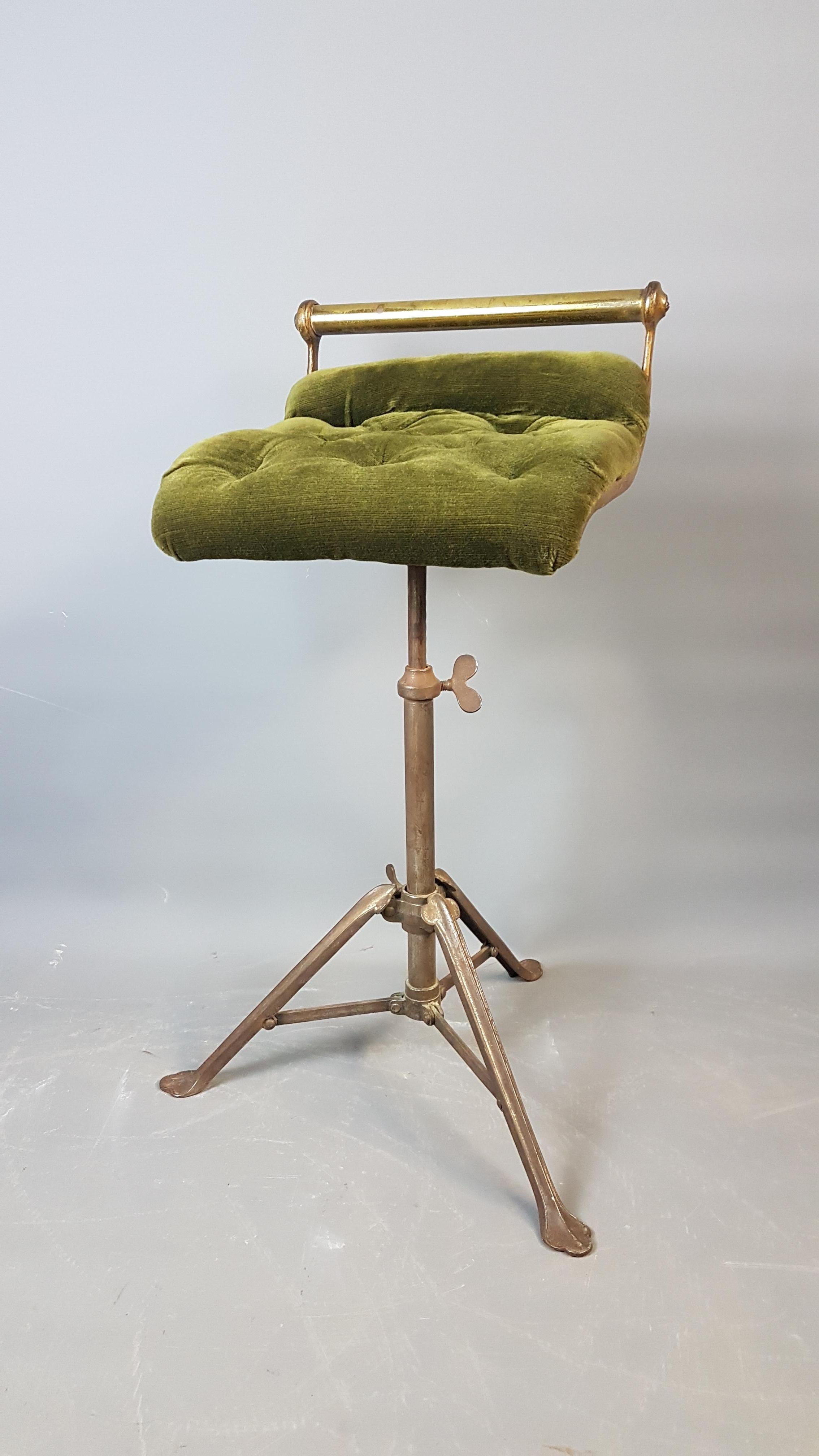 A beautiful original Cello stool by C.H.Hare that dismantles for storage or ease of transport. The seat pad is the original green velvet with buttoning (one button missing).The legs unfold and bolt in place with the nut and the seat rises through