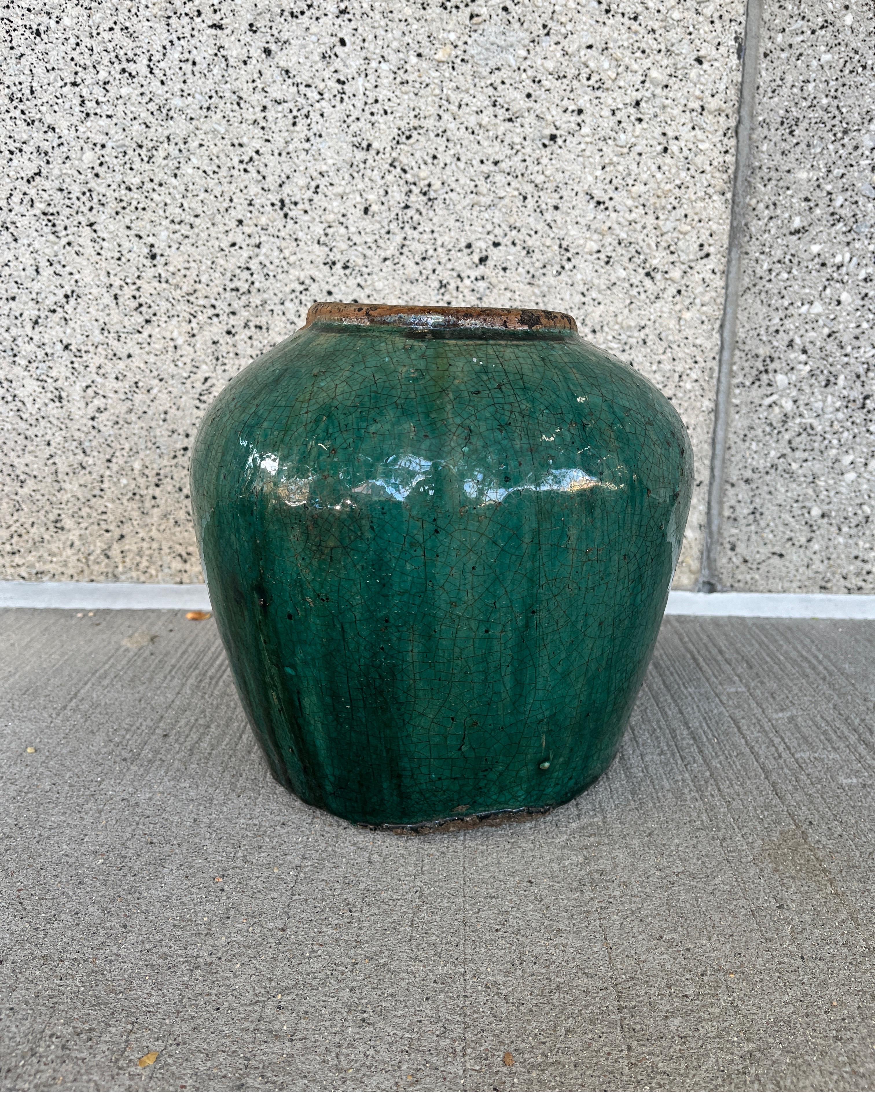 Originally used to store pickled ginger, this large and heavy jar has a classic shape and great presence. Collected in Hunan Province, this beautiful 19th Century piece communicates history and the rich stories that come from many decades of use. A