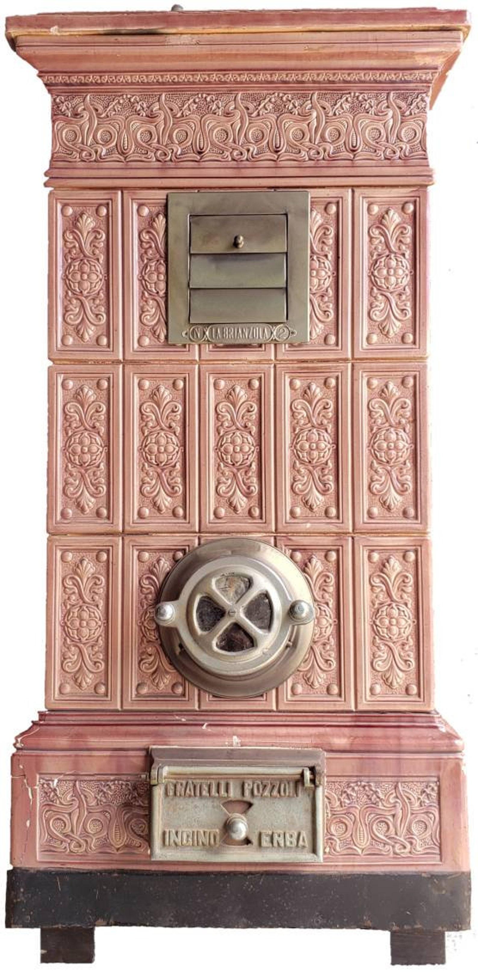 A rare and magnificent antique maiolica tiled heating stove from the late 19th century, monumental size, French Art Nouveau styling, Italian Alps origin, multi-fuel, finished in an attractive mauve finish with steel vents and door.

Handmade, signed