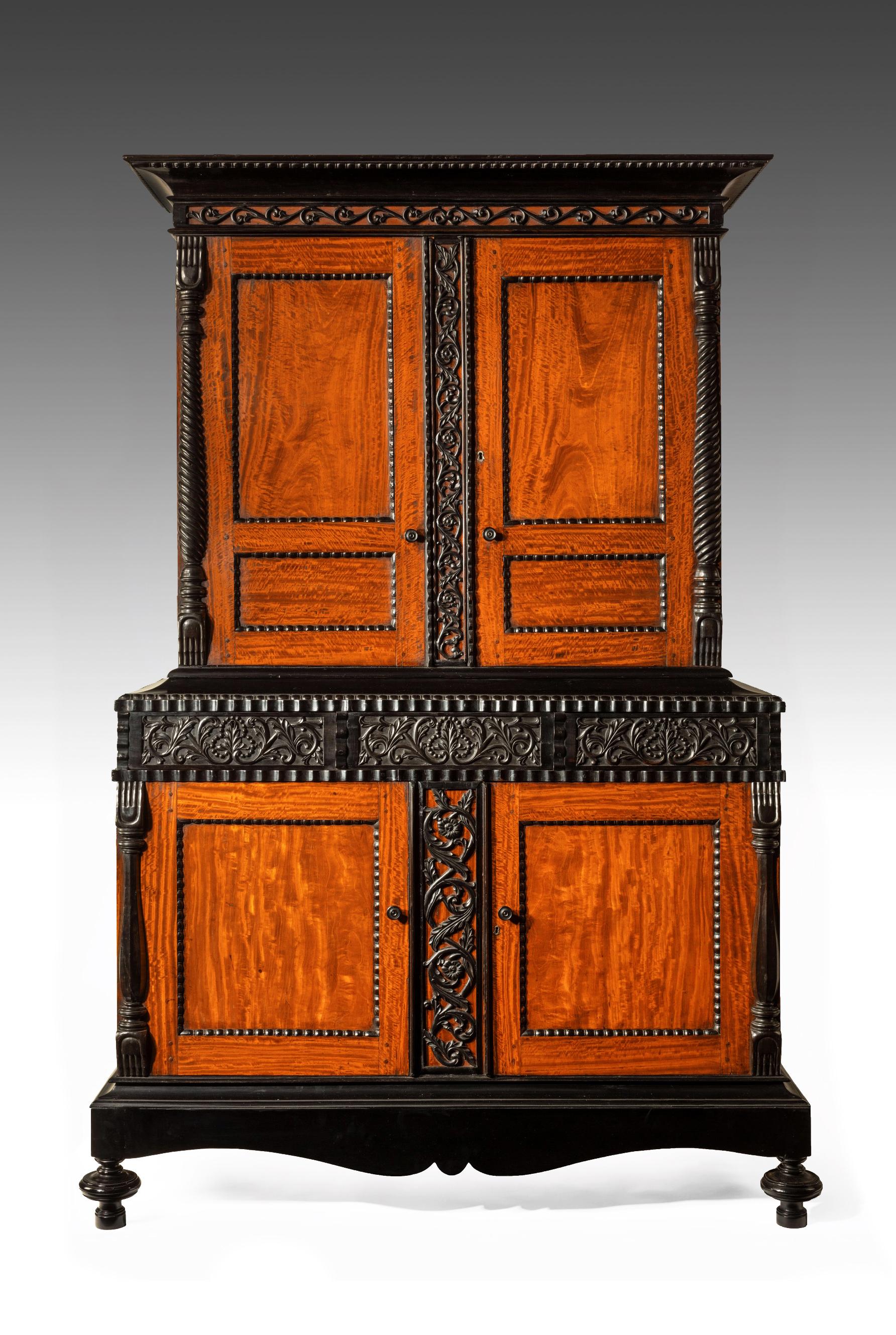 A fabulous exhibition quality early 19th century Ceylonese Indo-Dutch solid satinwood and ebony cabinet.

Ceylon (Sri Lanka) circa 1830. 

A stunning and rare Dutch Colonial satinwood cabinet / armoire with ebony carved detail. 

The solid