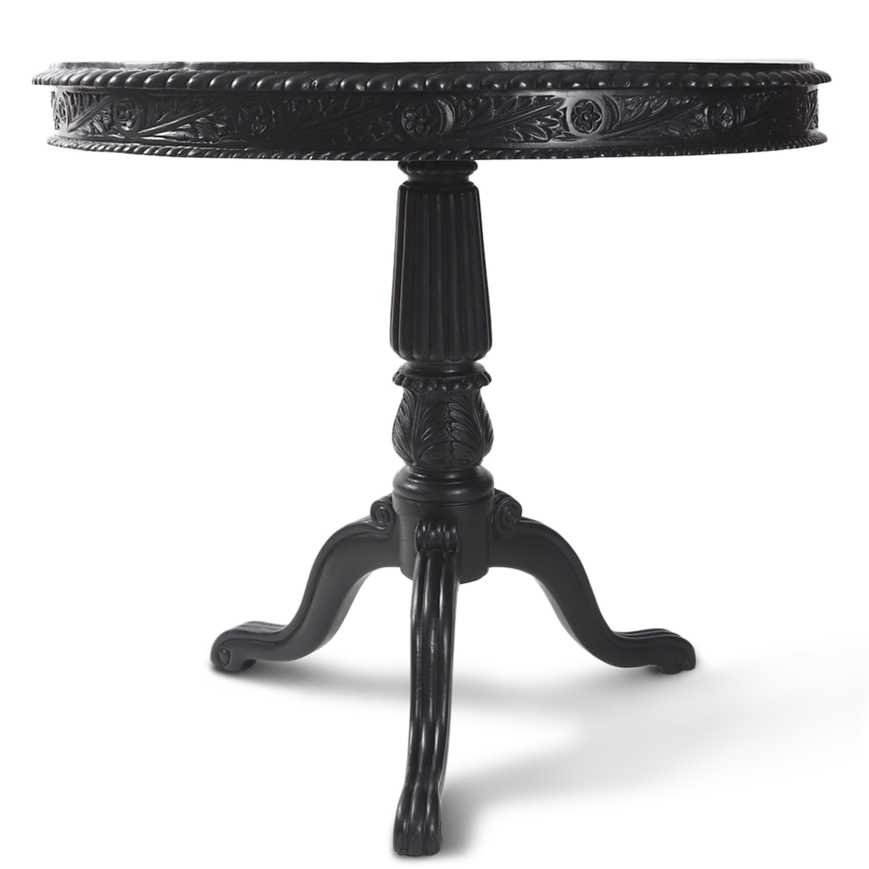 A 19th century Ceylonese specimen tilt-top center table with an ebonized finish. It features an exotic wood inlay in a mesmerizing radiating pattern on its face and beautifully carved details on the top apron and paw feet.