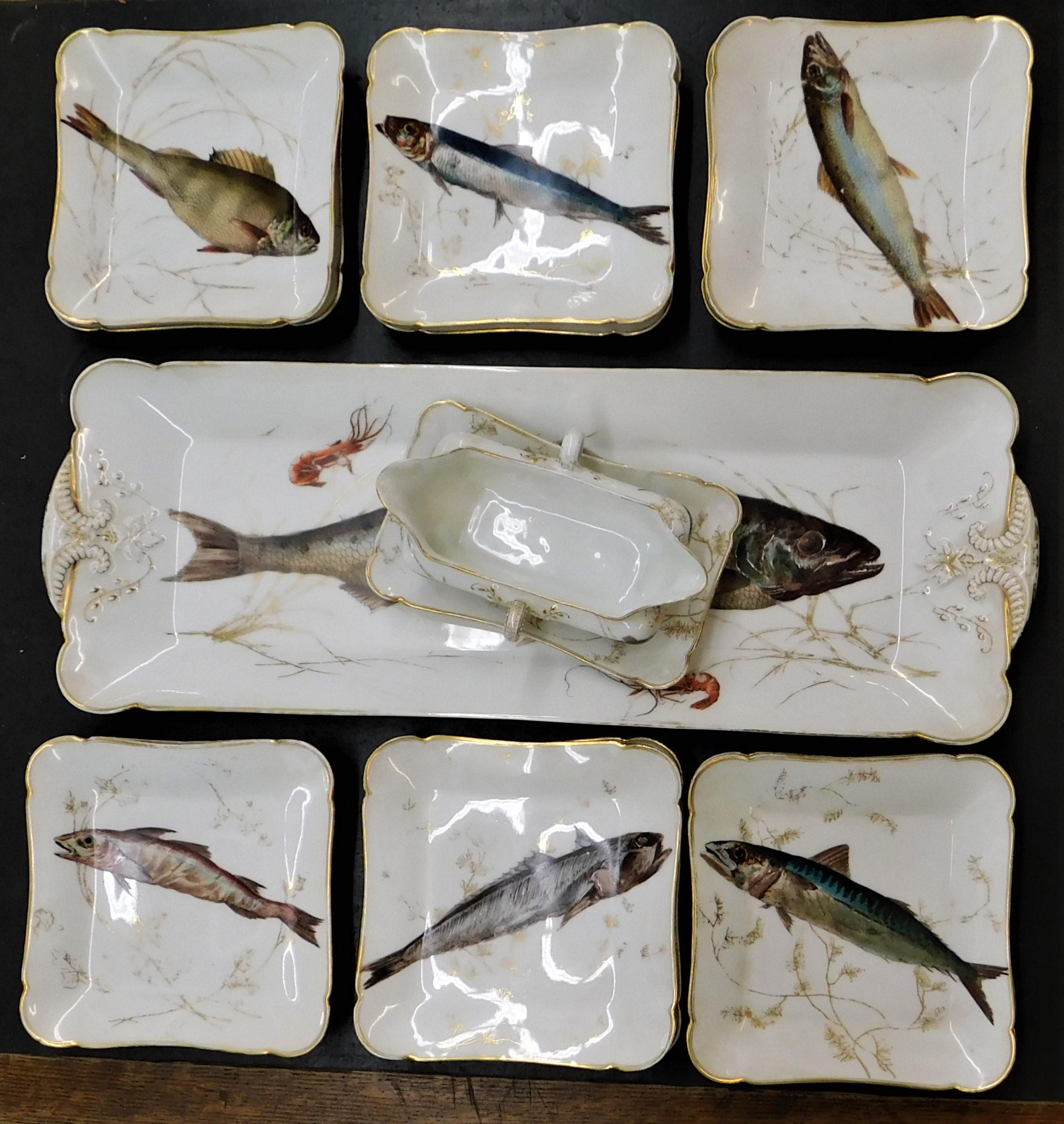 Charles Field Haviland Limoges France Aesthetic Movement set of 15 with various fish hand-painted designs porcelain China with gold gilt edges, circa 1890. 12 plates with 6 different fishes, 7.5 inches by 7.5 inches each plate. Large fish platter