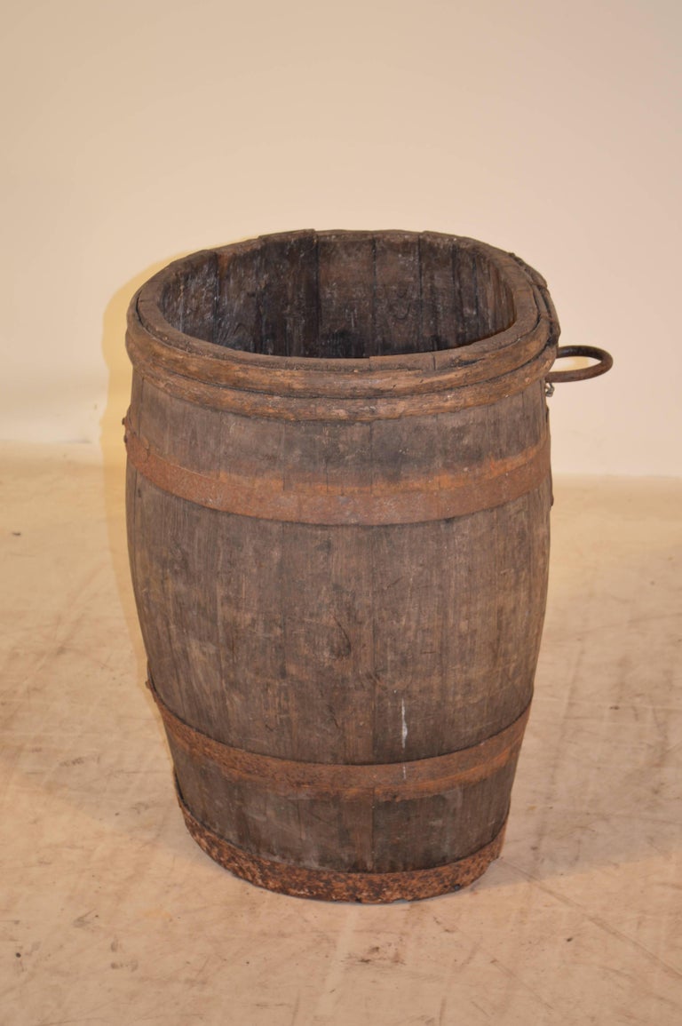Early 19th century French champagne-grape hod made from oak, fastened together by metal banding and grapevine banding.