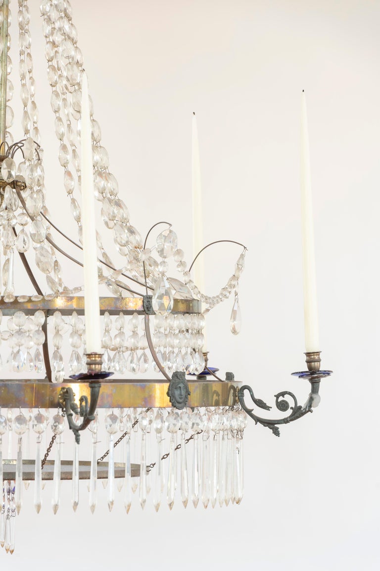 Magnificent chandelier from the early 19th Century with cut crystal and cobalt glass accents is from the Baltic region. Medusa medallions are applied to the frame to offer interest and symbolize falling in love. The chandelier is not wired, rather
