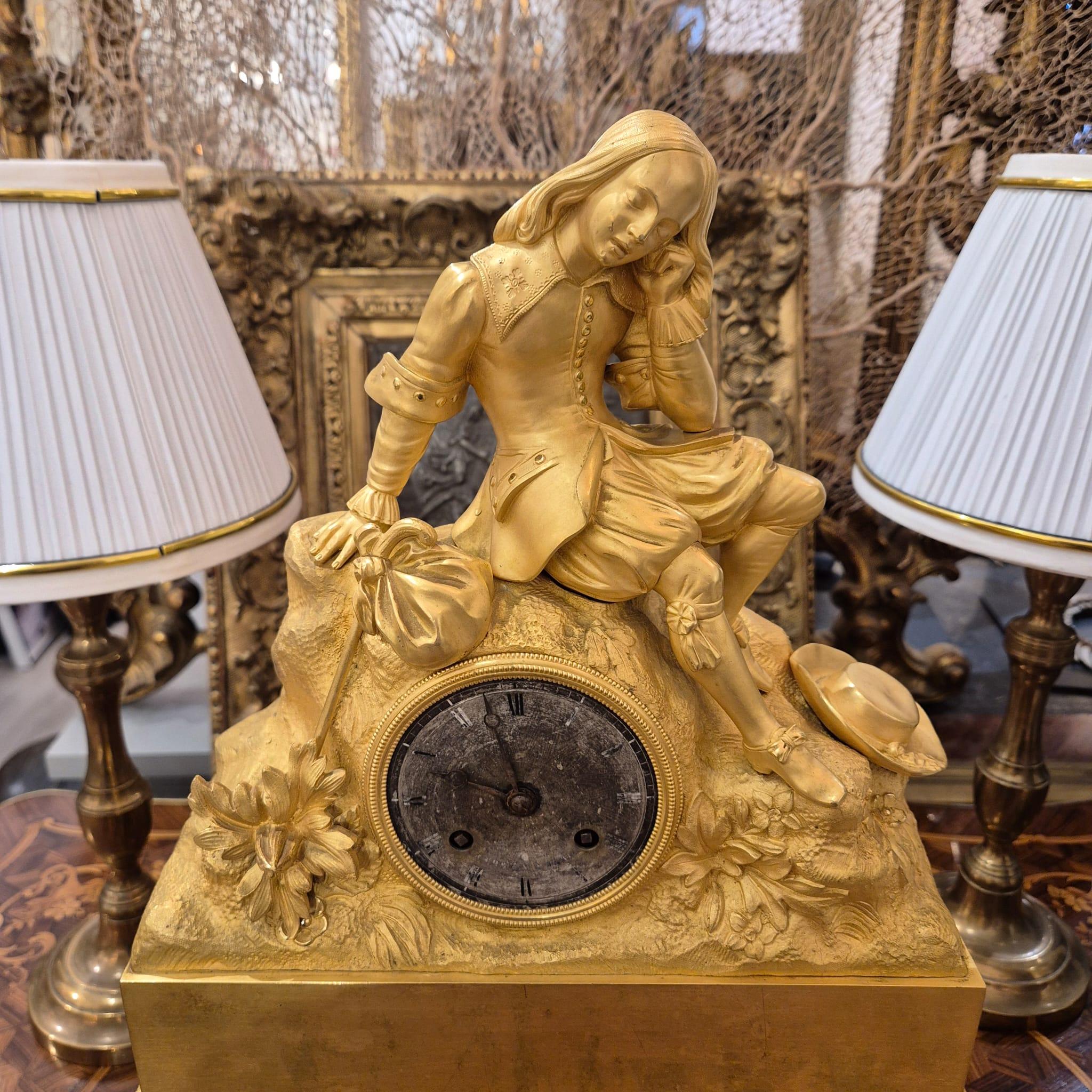 Bronze 19th Century Charles X Clock with a Statue of a Romantic Young Nobleman. For Sale