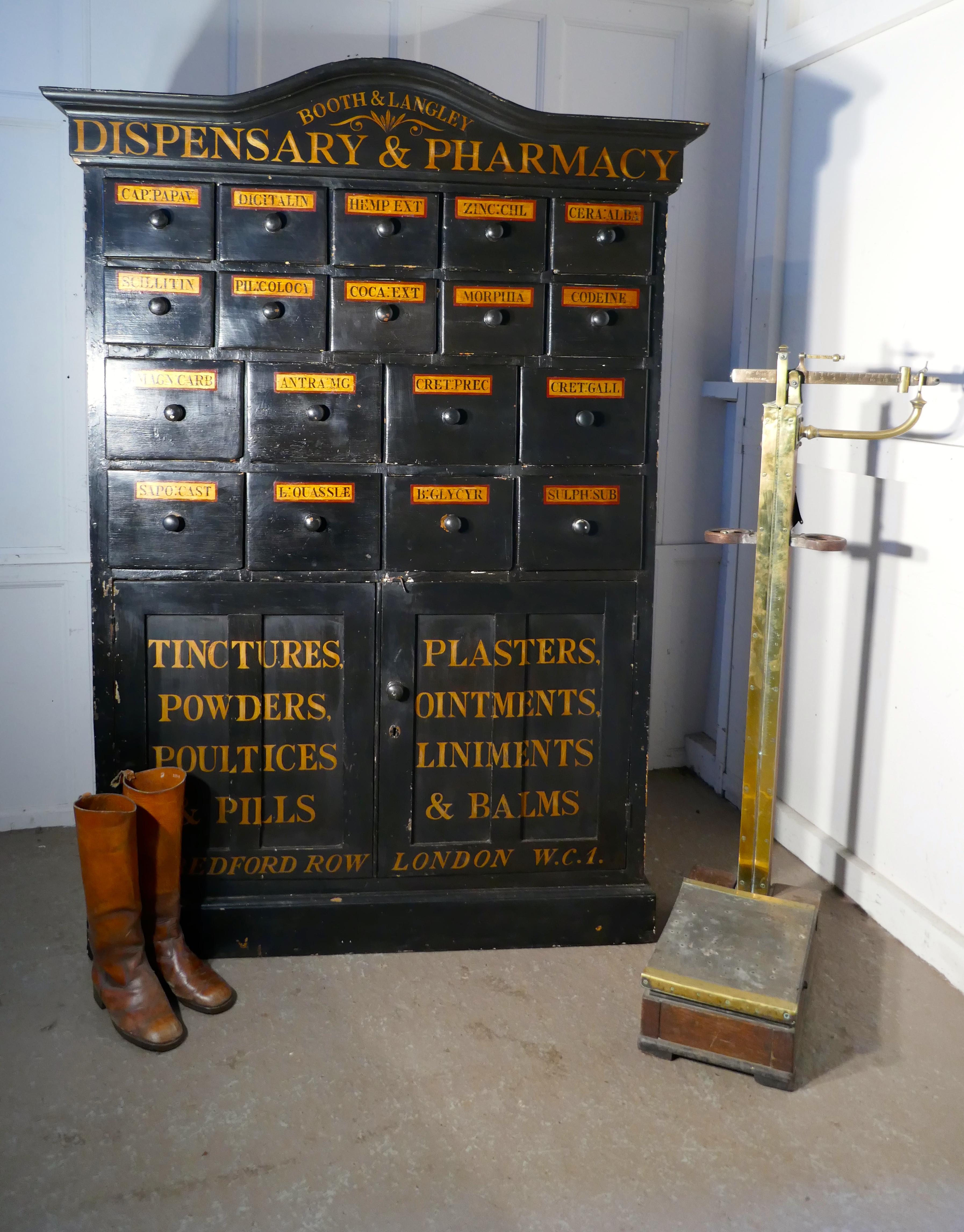 19th century chemist drawers 37 drawer, painted pharmacists cabinet

This is a delightful piece of Social History, the tall black cupboard has come from an old chemist shop
The cabinet has 10 small drawers, 8 slightly Larger drawers and a shelved