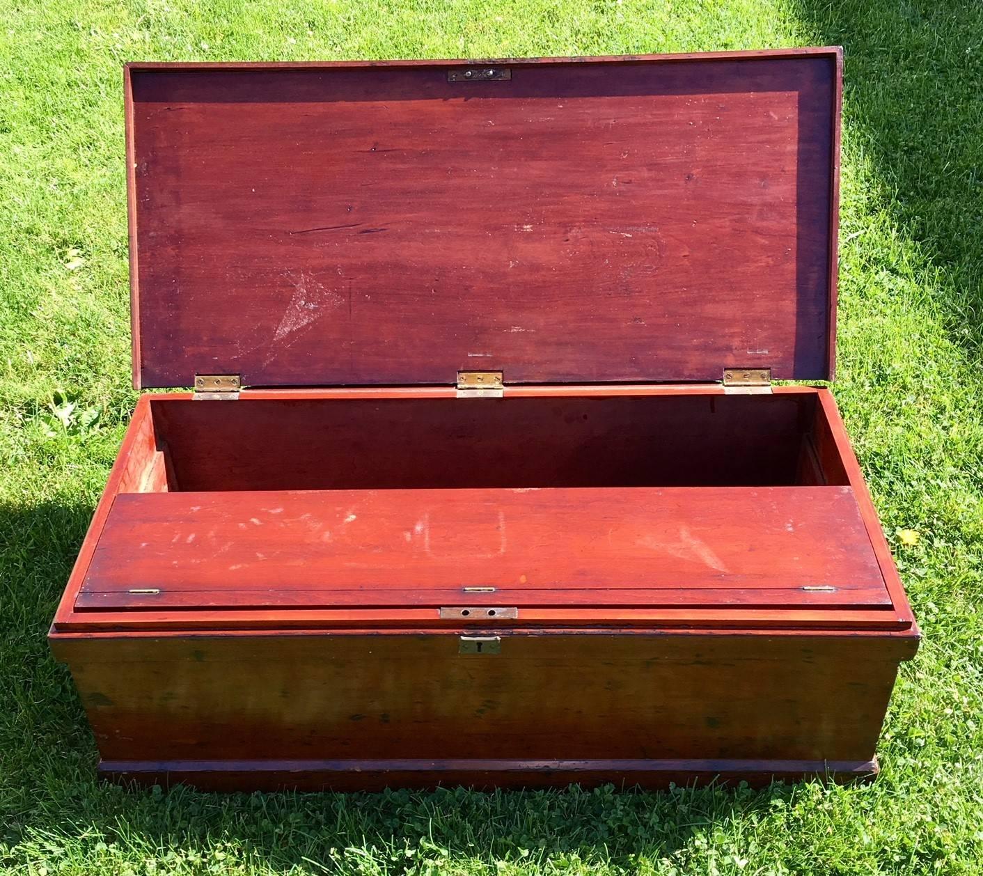 19th century English cherry raised panel tool chest, circa 1870, a fine quality rectangular six board chest, having a lid with a deep relief raised panel, original brass hinges and side bail handles, and fitted interior with a series of sliding