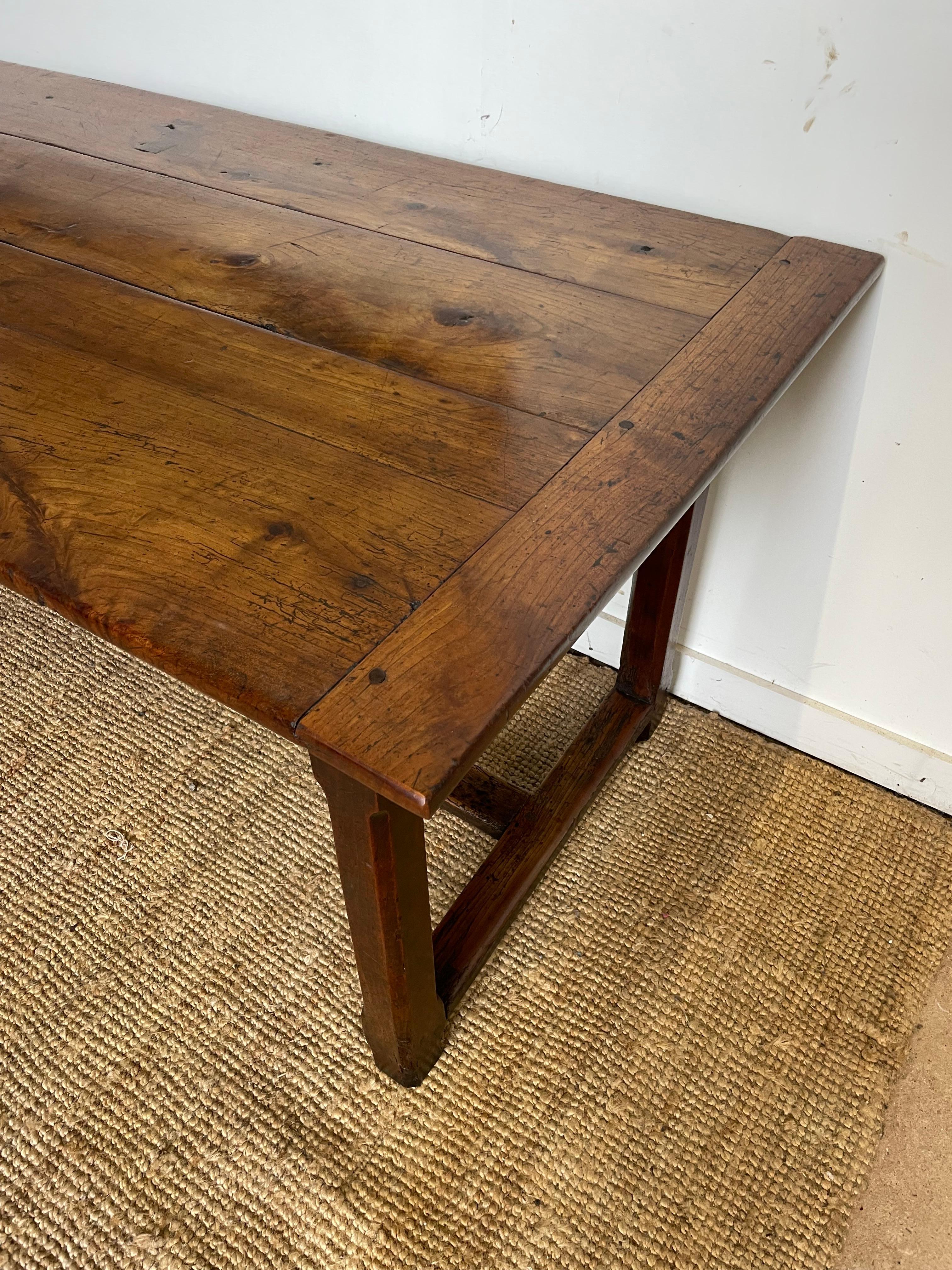 Great example of an early 19th century cherrywood farmhouse table.

With a drawer at each end and a small side drawer. 

This table would seat 8 people around it comfortably.

Normandy, France, Circa 1820. 

H: 76 cm (29 15/16