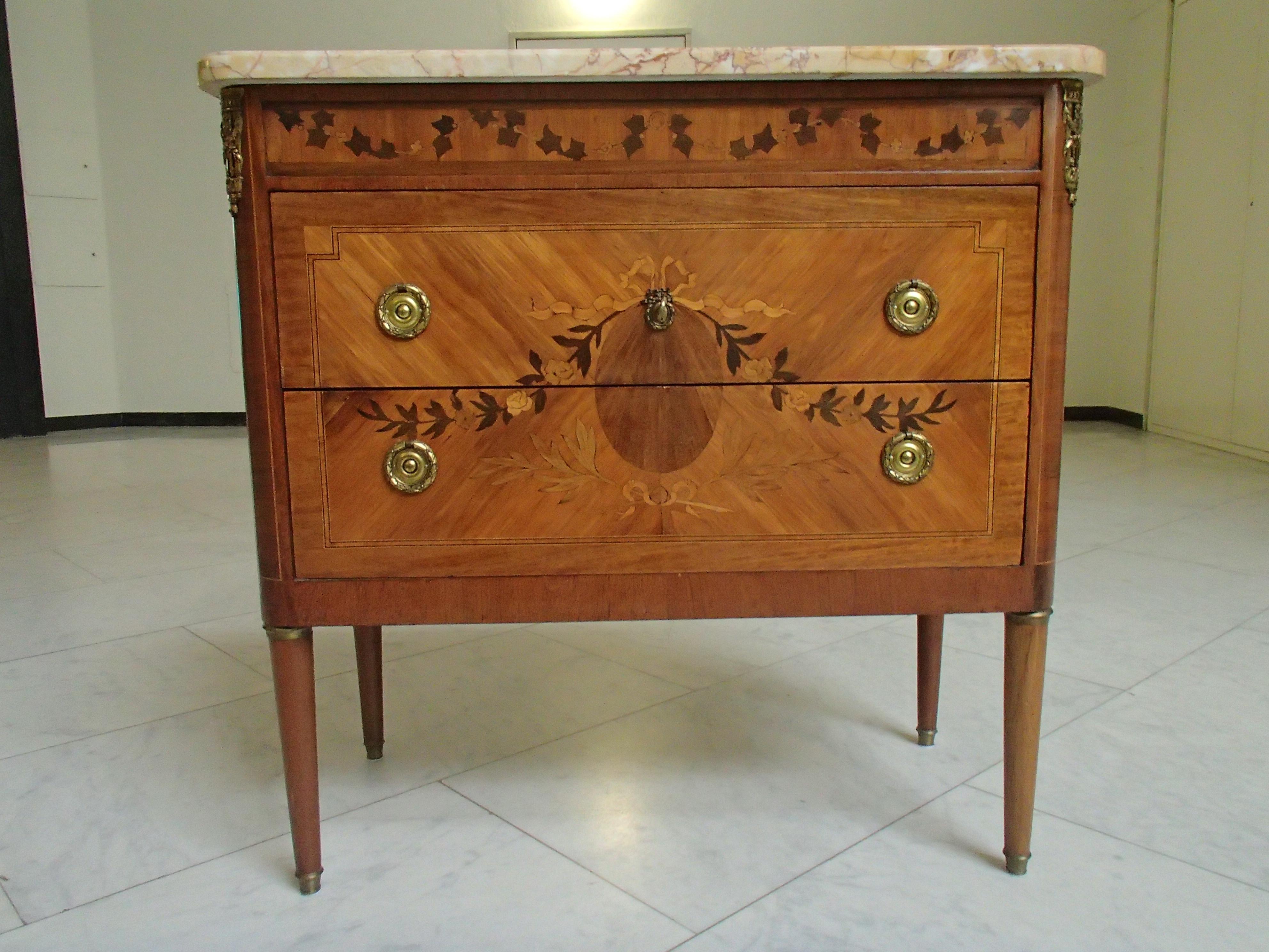 19th century chest of drawers Louis XVI style by Mercier Freres, Paris with inlays and brass decorations.