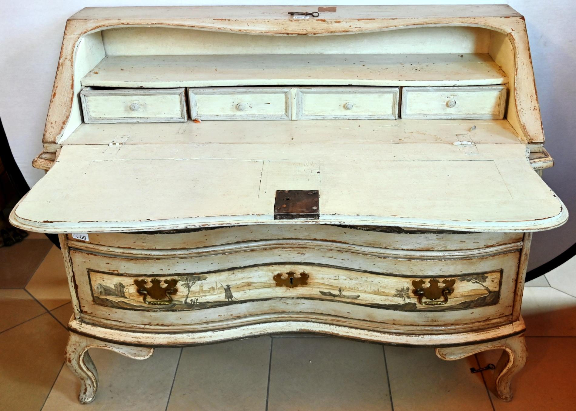  19th century chest of drawers in country style painted in pale grey colors with 2 drawers. Original handles in brass with keys. The painting shows a decorative baroque Dutch landscape. 
Depth when closed 50 cm, 80 cm when open.