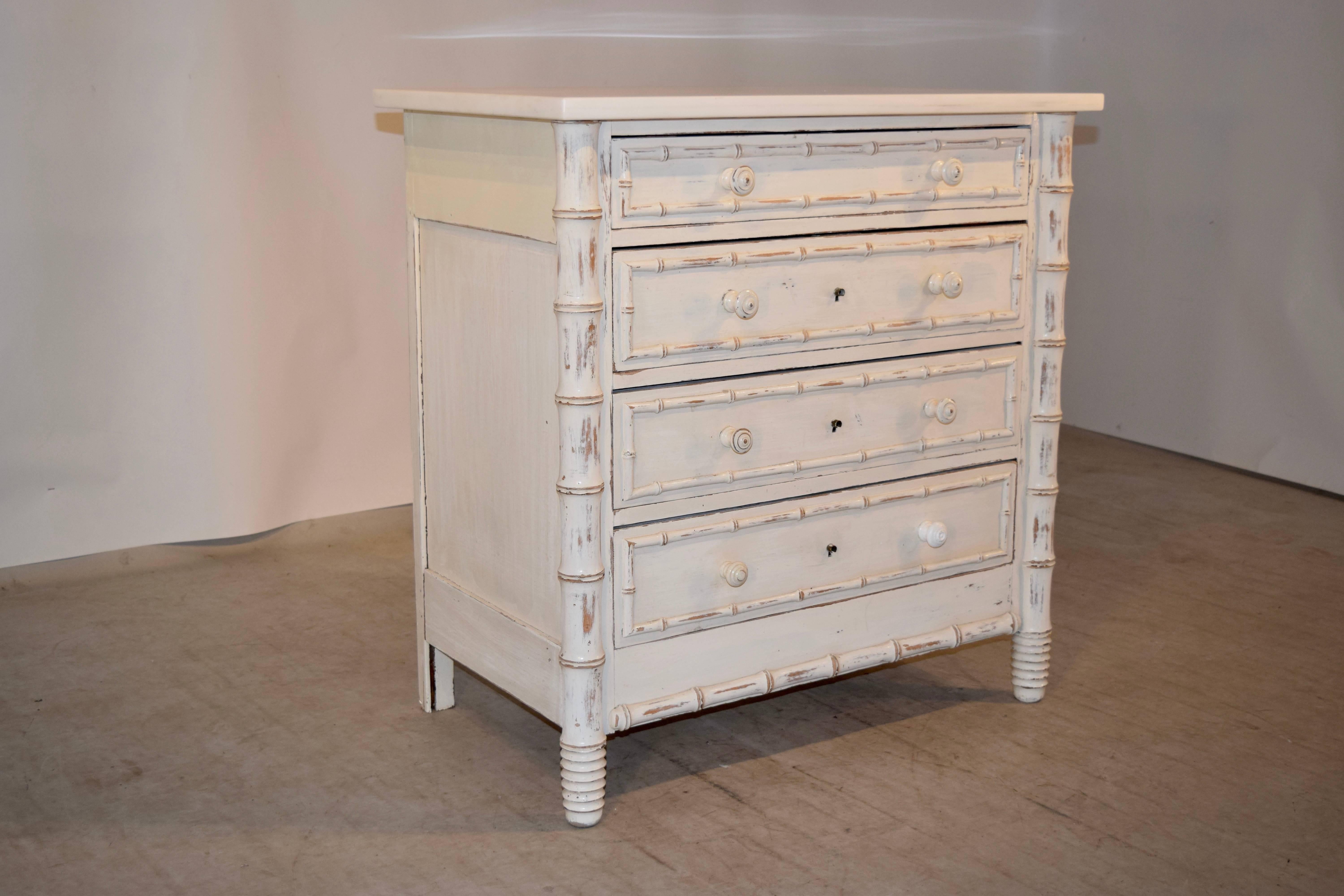 19th century small French chest with a new marble top, following down to a small chest with four drawers, all banded in faux bamboo trim and panelled sides, supported on hand-turned feet.