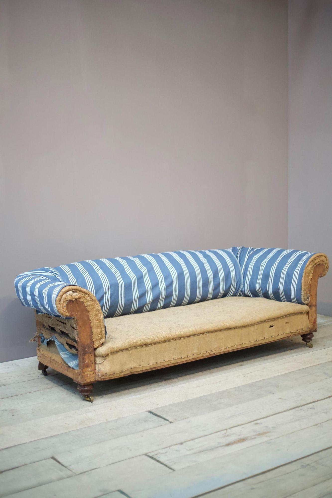 This is a superb quality late Victorian scroll arm Chesterfield sofa by renowned maker Cornelius V Smith. The quality of the sofa is superb with great shape and tightly turned mahogany legs. The proportions make this a very comfy sofa and ideal for