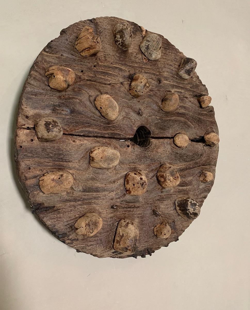 A attractive chestnut crusher completely made of chestnut wood. The years of use has smoothened out the areas around the grinders as a river polishes a rock. Art made by time.