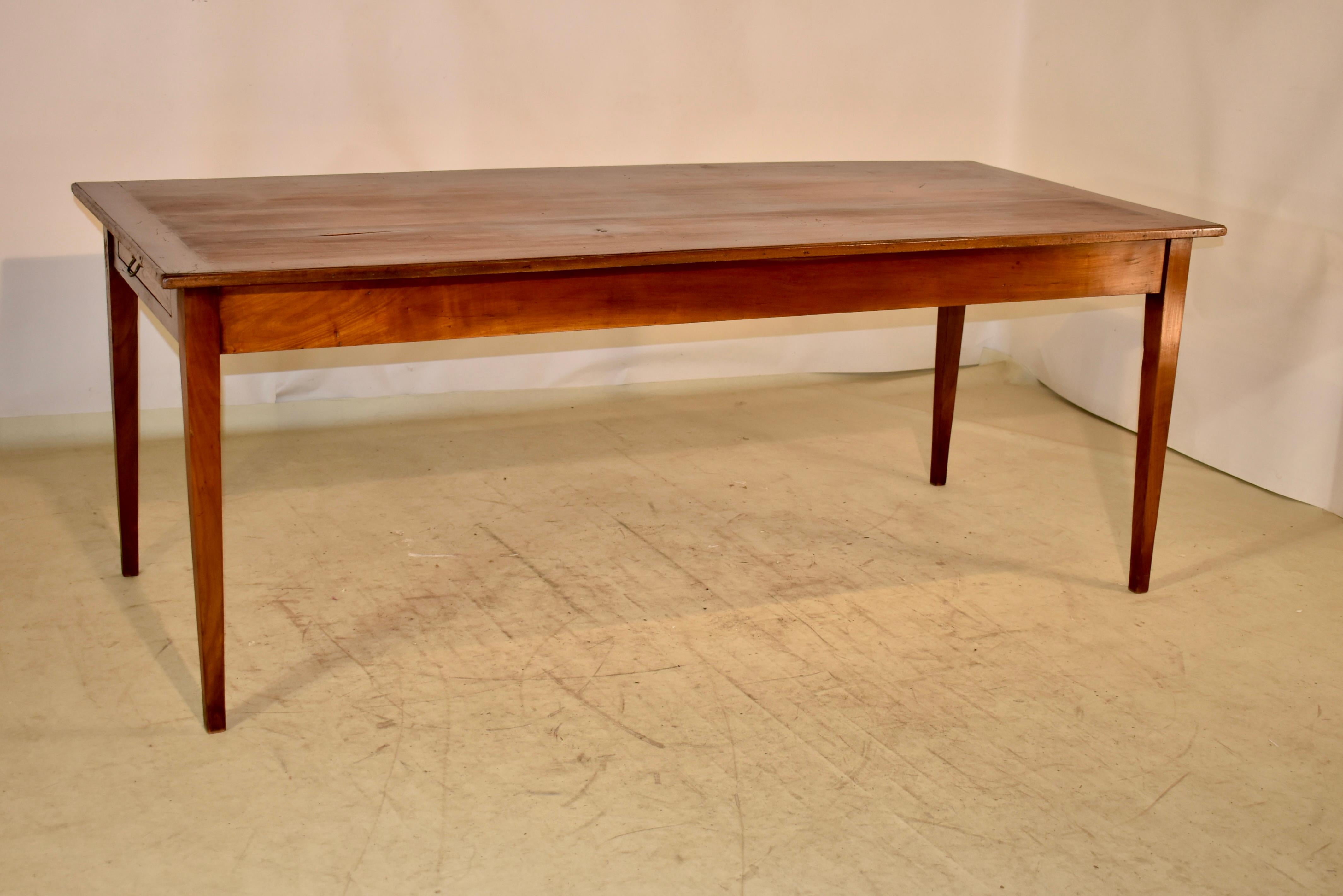 19th century chestnut farm table from France.  The table has a wonderful color and patina throughout.  The top is made from wider and wonderfully grained boards with banded ends, which help with shrinkage in the top over the years.  The top follows