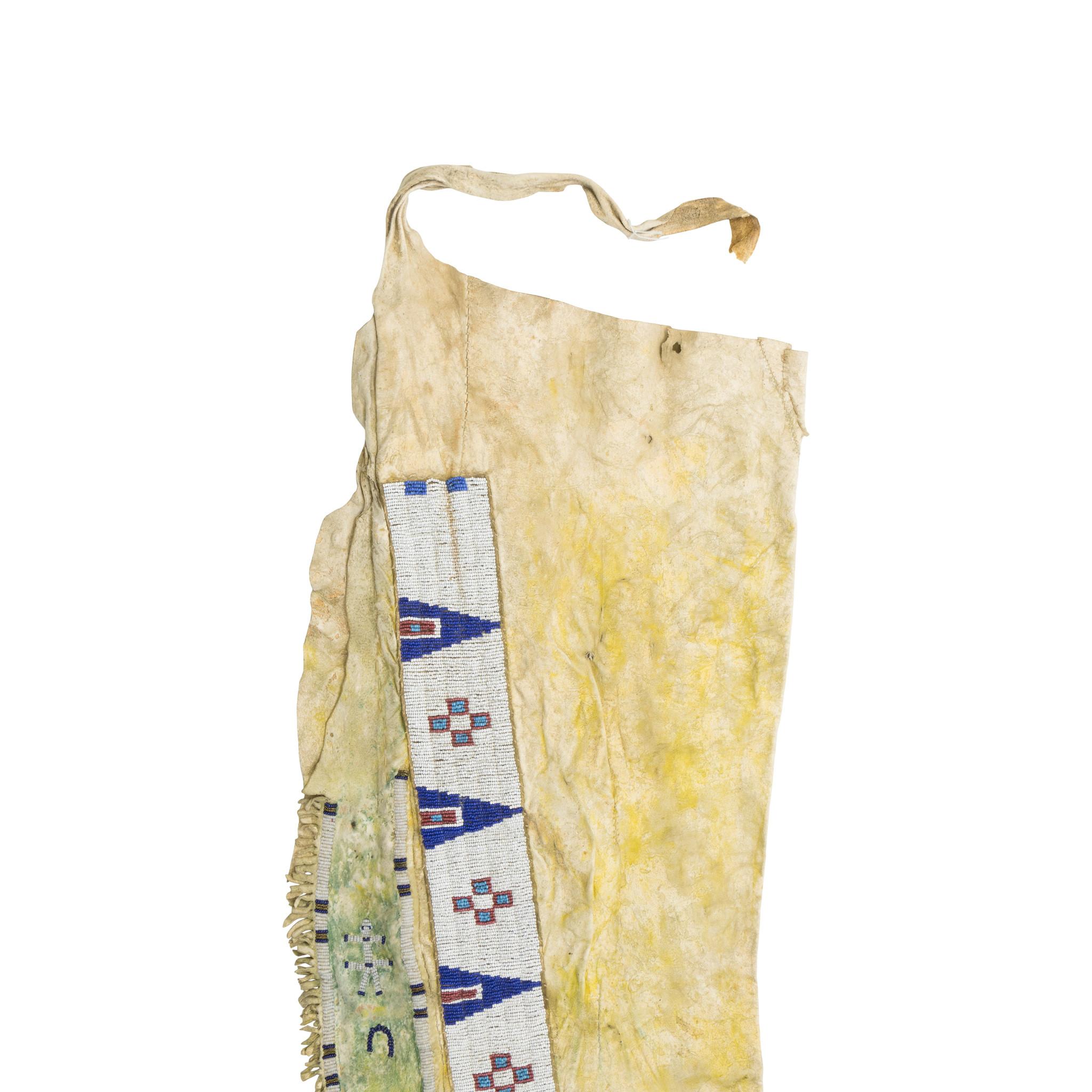 Cheyenne pictorial leggings with horseshoes (horse stealing). Brain tanned deer skin, yellow ochre and green with red ochre on reverse. Older bead shirt strips sinew sewn and moved over onto leggings. Great for display in a handmade indigenous
