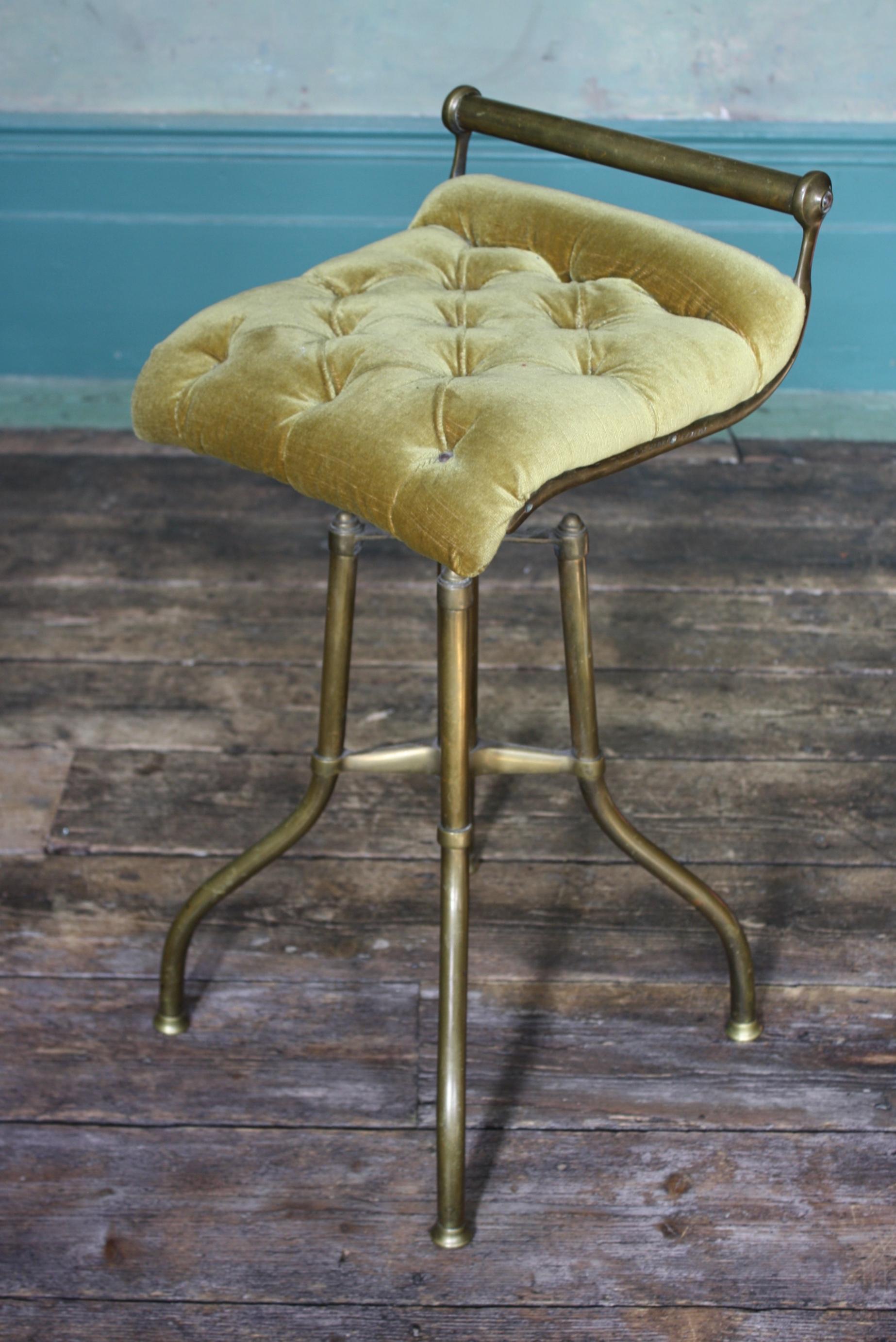 A very good example of a late Victorian music/Cello adjustable stool.

Formed from tubular and cast brass, with the C. H. Hare Stamp, a deep buttoned mustard yellow velvet seat.

The seat adjusts on a large screw system, the brass has age