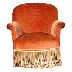 Sillón infantil de terciopelo del siglo XIX con flecos decorativos