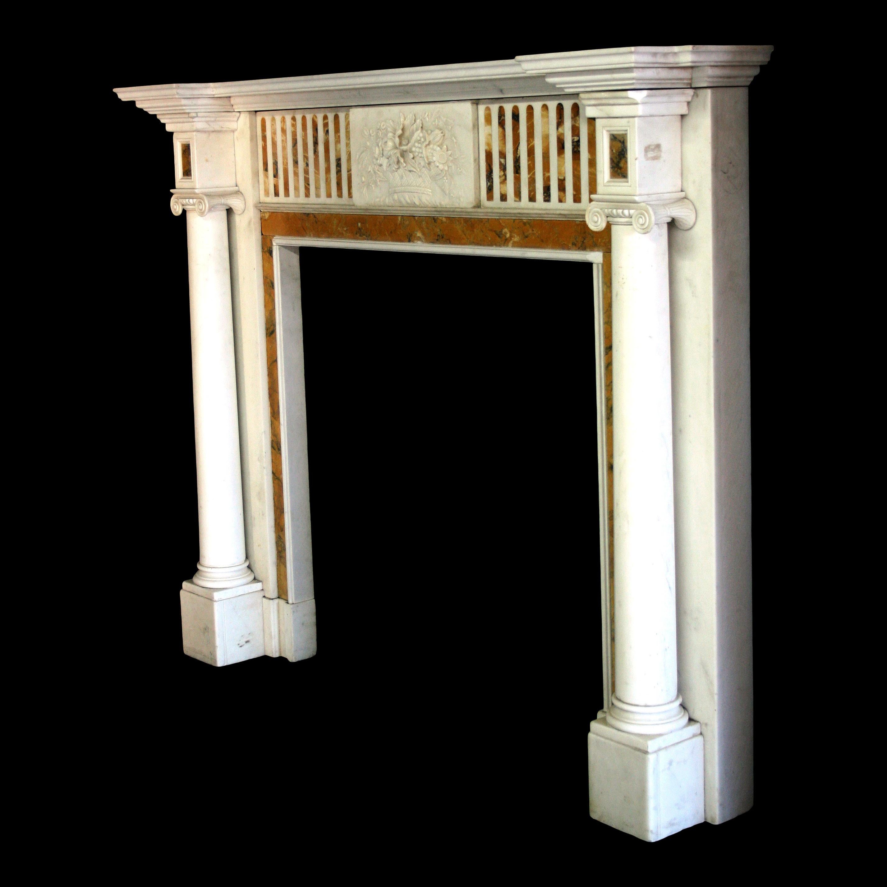 A 19th century Classical Chimneypiece in the George lll manner, in Statuary and Siena marble. The jambs have freestanding plain columns on block feet with Ionic capitals, with a Siena in- ground, and Statuary back panel and returns.
The centre